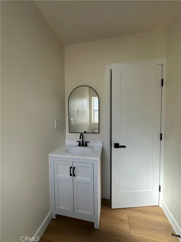 a white toilet sitting next to a shower