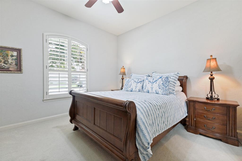 971 Elk Ridge Road Prosper, TX 75078 - Photo 16 of 29 Spacious second bedroom with arched window and plantation shutters.