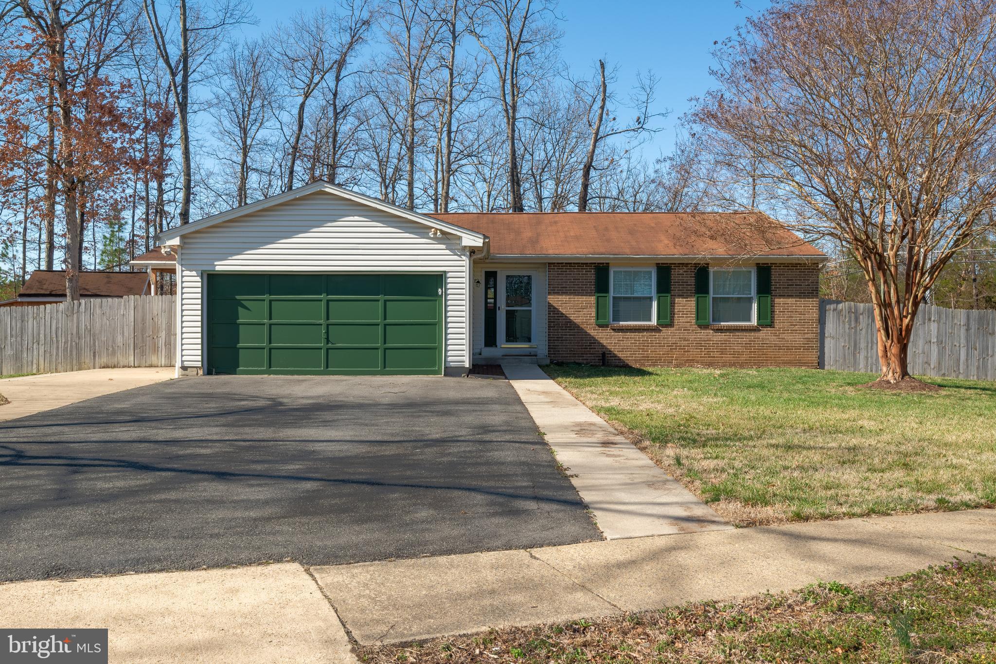 4535 Cub Run Road Chantilly, VA 20151 - Photo 1 of 49 a front view of a house with a garden