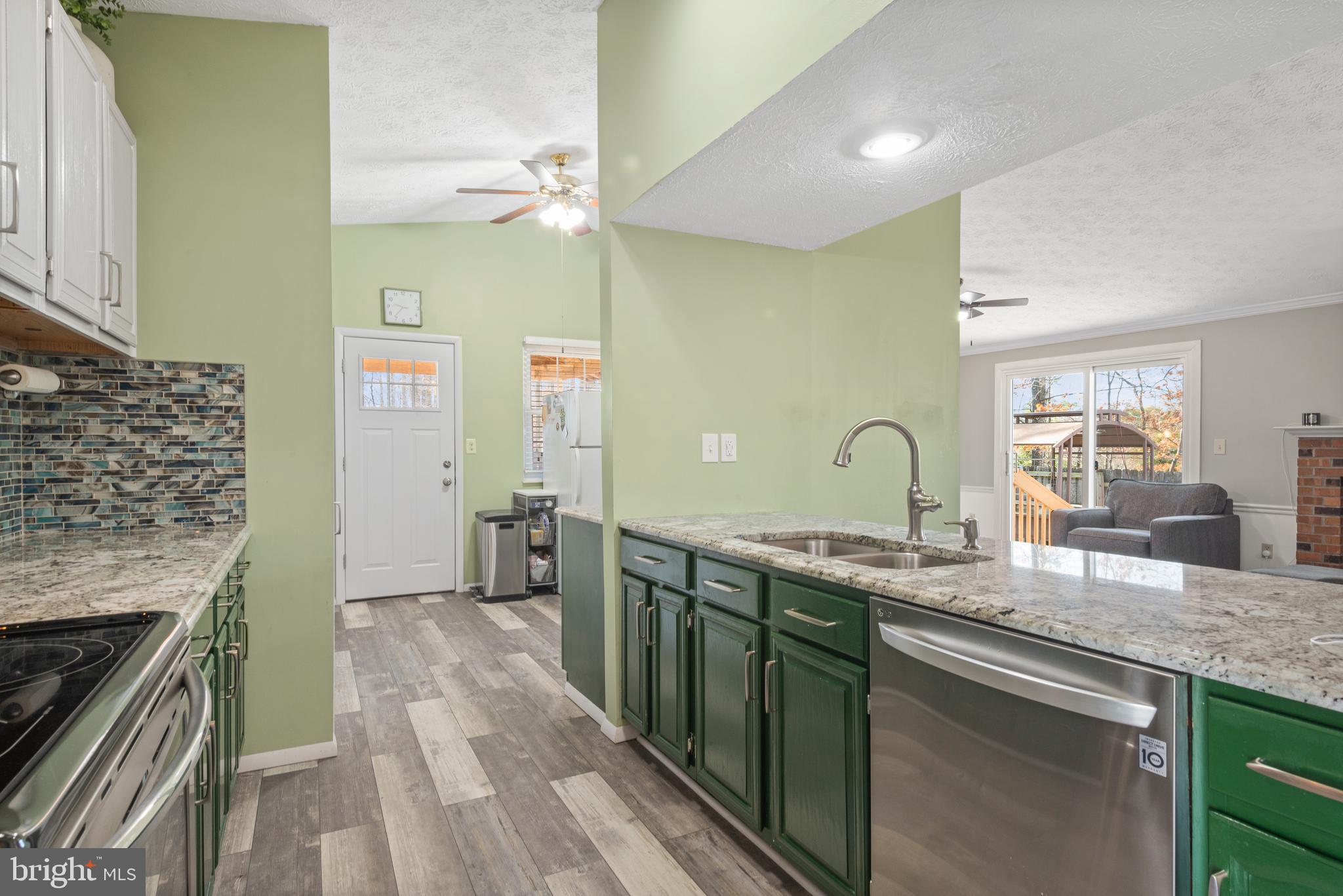 4535 Cub Run Road Chantilly, VA 20151 - Photo 18 of 49 a spacious bathroom with a granite countertop sink a mirror and a shower