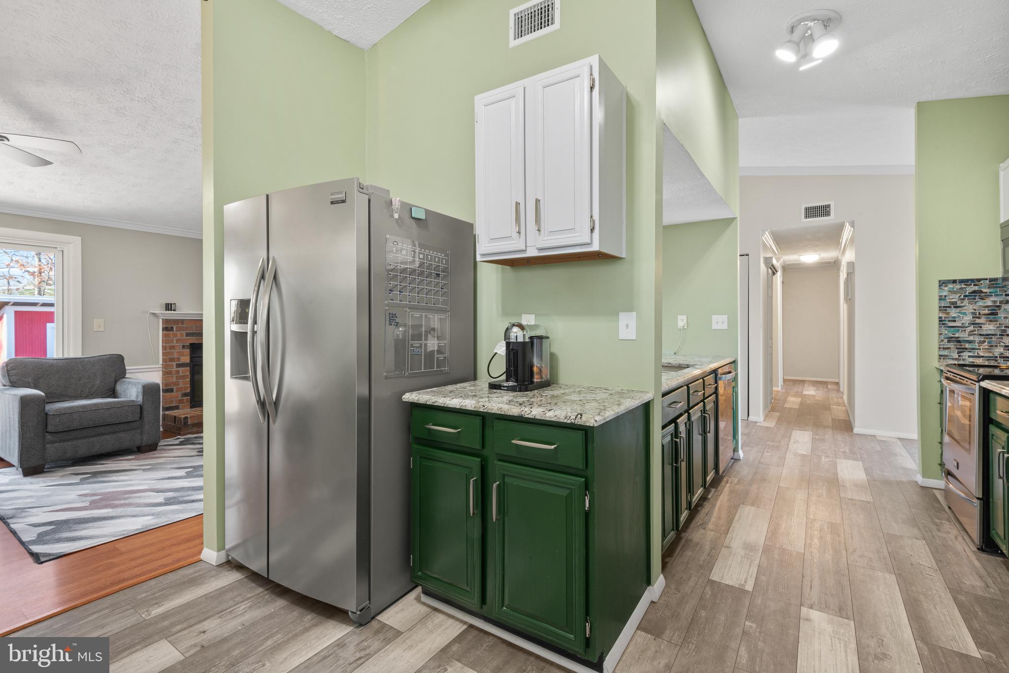 4535 Cub Run Road Chantilly, VA 20151 - Photo 19 of 49 a kitchen with stainless steel appliances a refrigerator and a cabinets