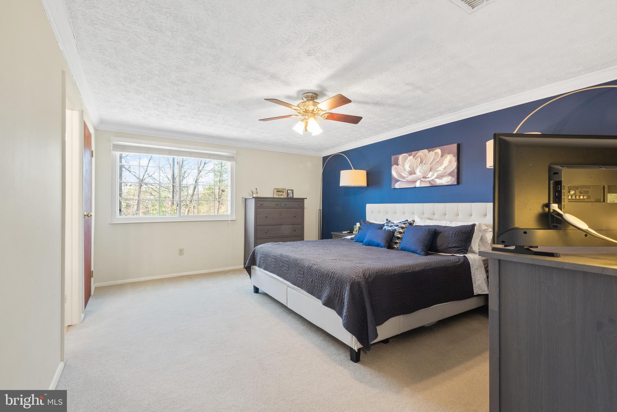 4535 Cub Run Road Chantilly, VA 20151 - Photo 23 of 49 a bedroom with a bed and a chandelier