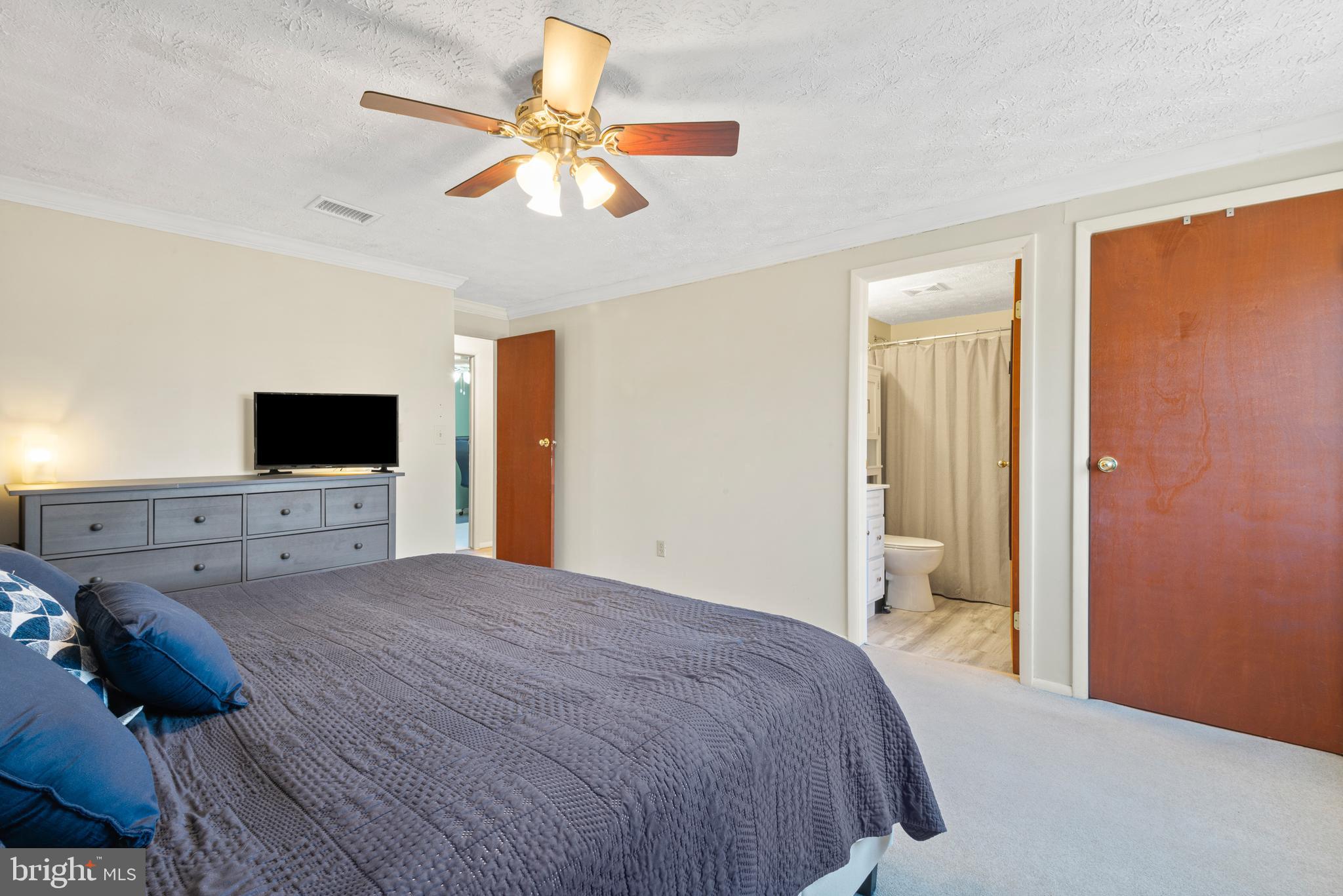 4535 Cub Run Road Chantilly, VA 20151 - Photo 26 of 49 a bedroom with a bed and a flat screen tv