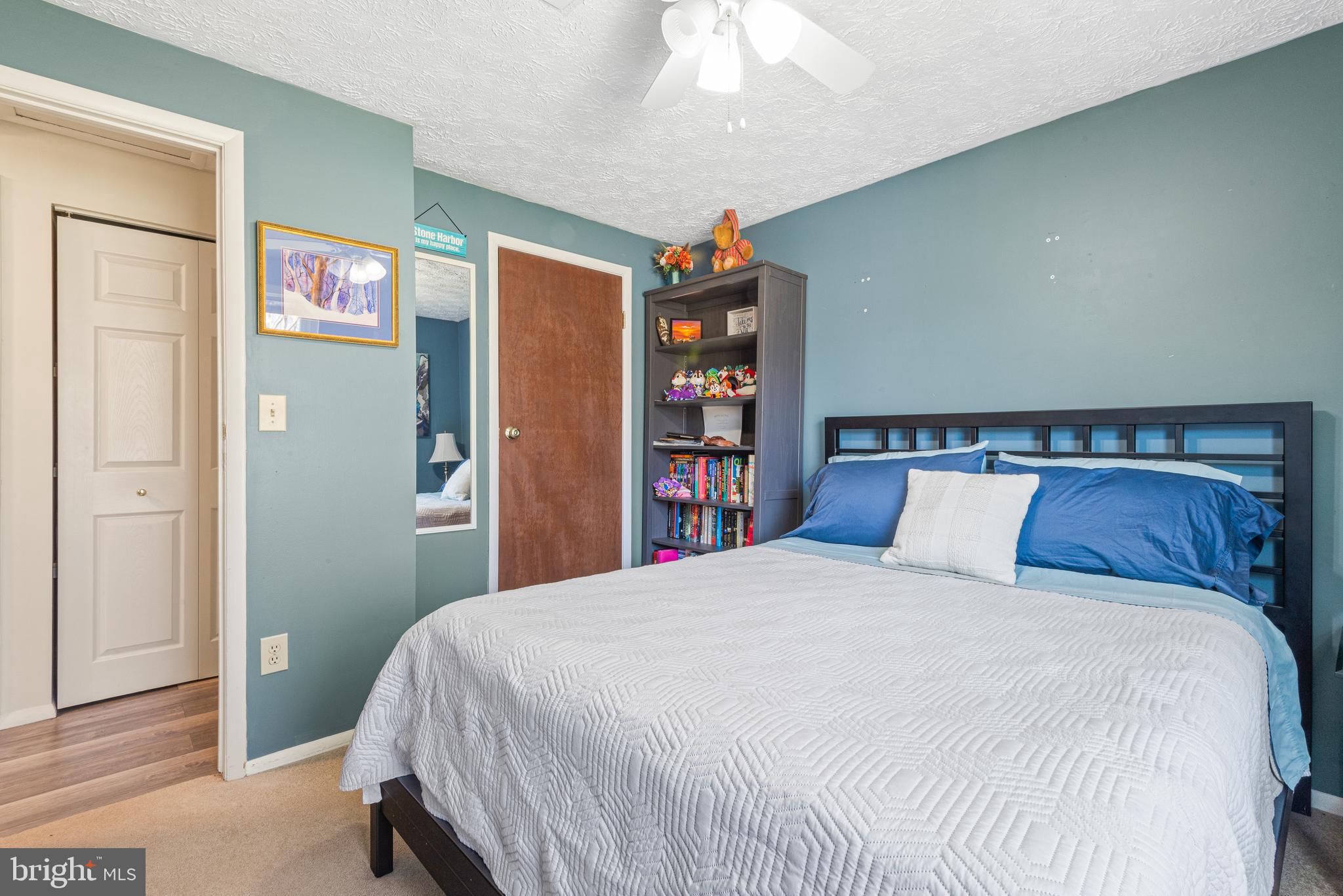 4535 Cub Run Road Chantilly, VA 20151 - Photo 29 of 49 a bedroom with a large bed and a chandelier