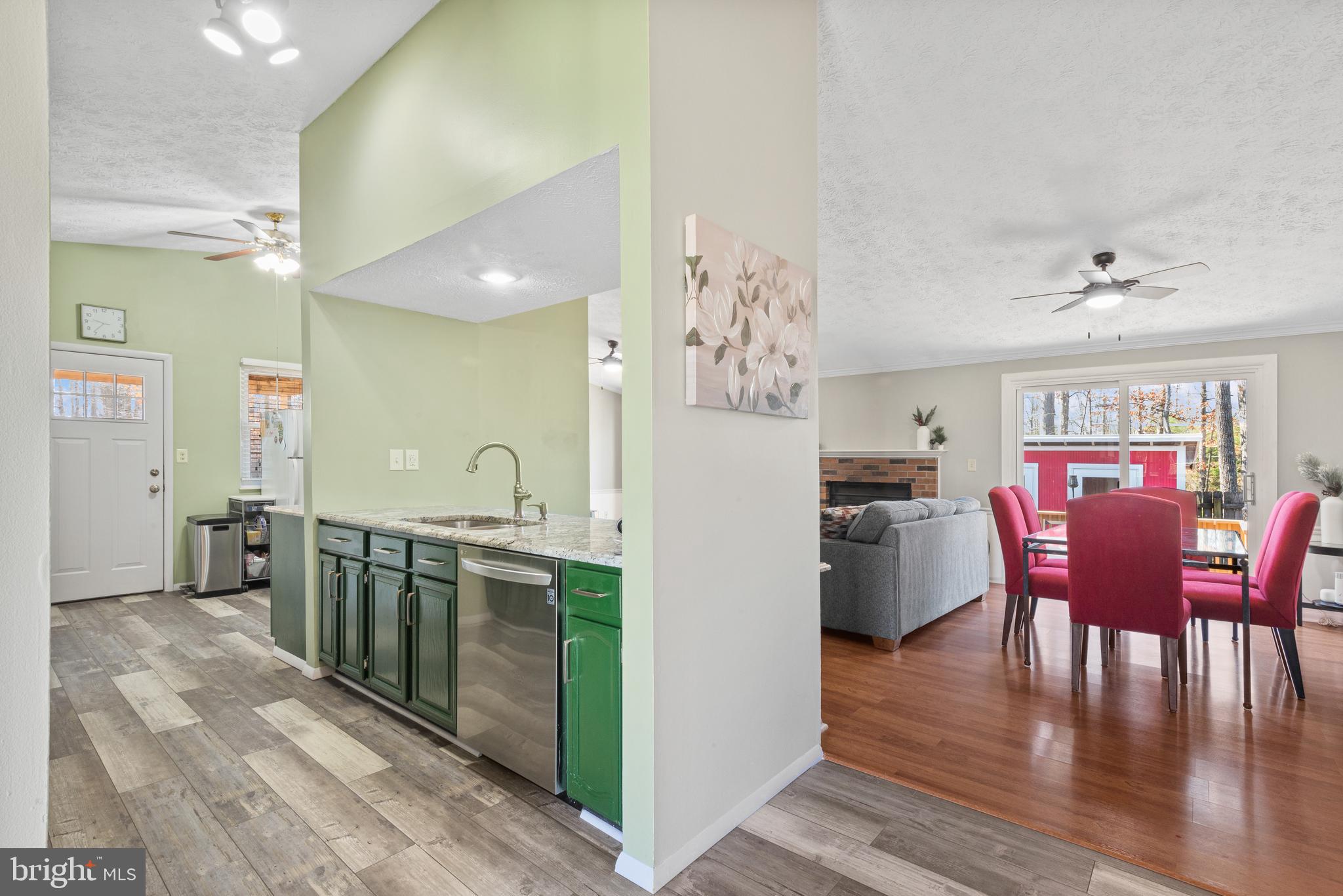 4535 Cub Run Road Chantilly, VA 20151 - Photo 6 of 49 a kitchen with refrigerator cabinets dining table and chairs