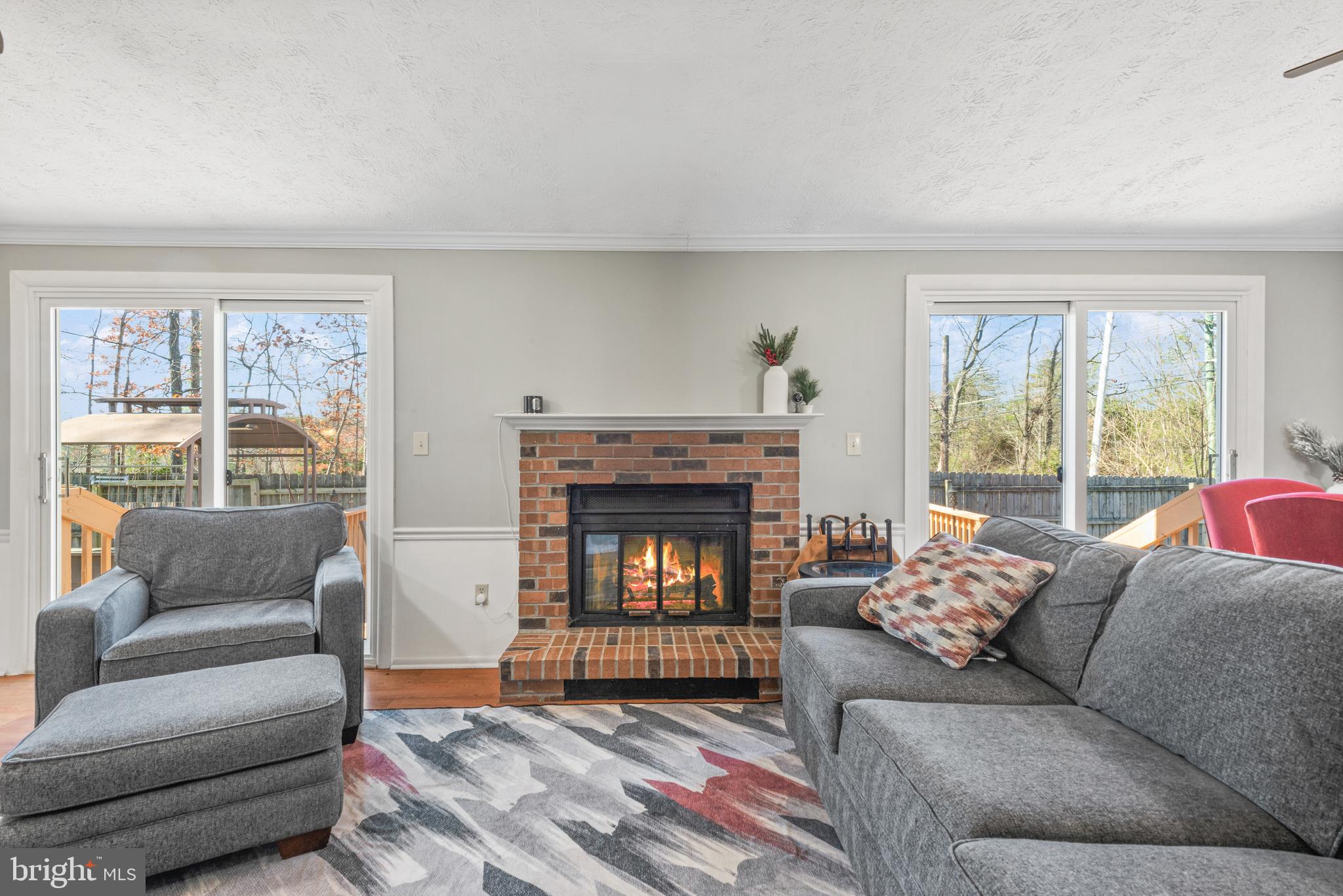 4535 Cub Run Road Chantilly, VA 20151 - Photo 8 of 49 a living room with furniture and a fireplace