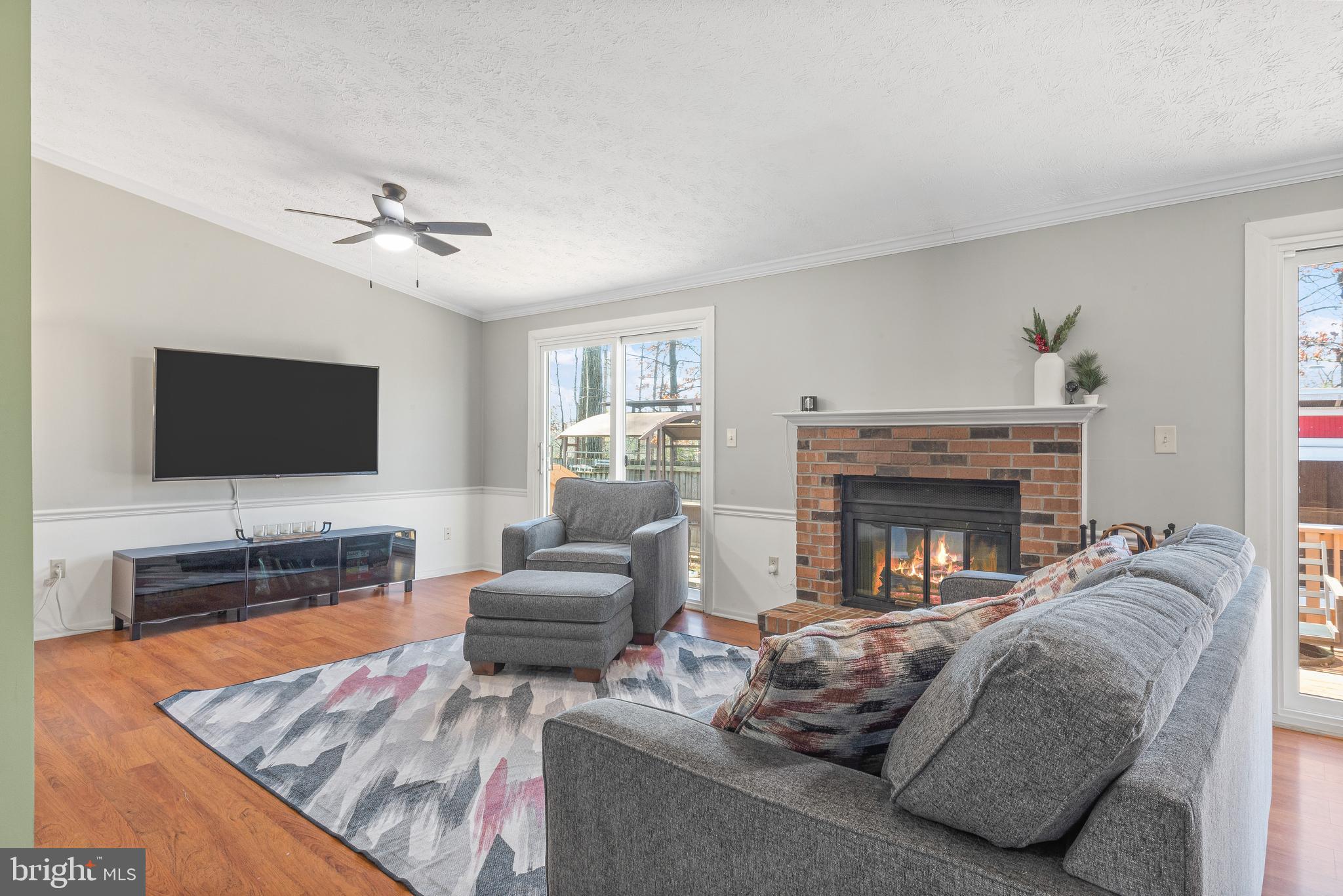4535 Cub Run Road Chantilly, VA 20151 - Photo 10 of 49 a living room with furniture and a flat screen tv