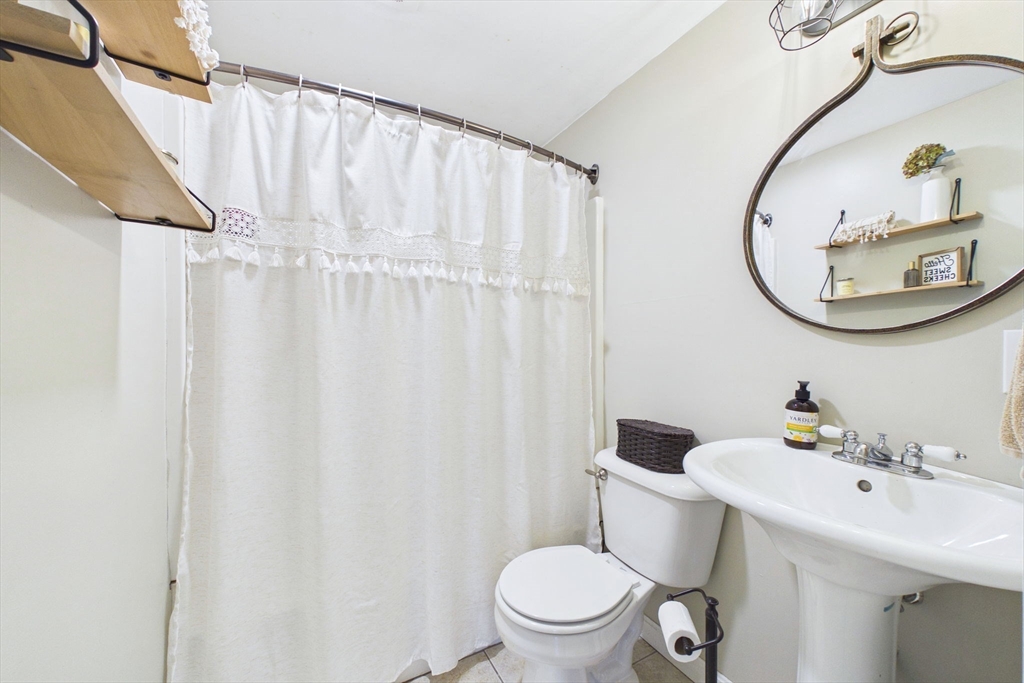 13 Albatross Avenue Wareham, MA 02538 - Photo 16 of 25 a bathroom with a sink mirror and toilet
