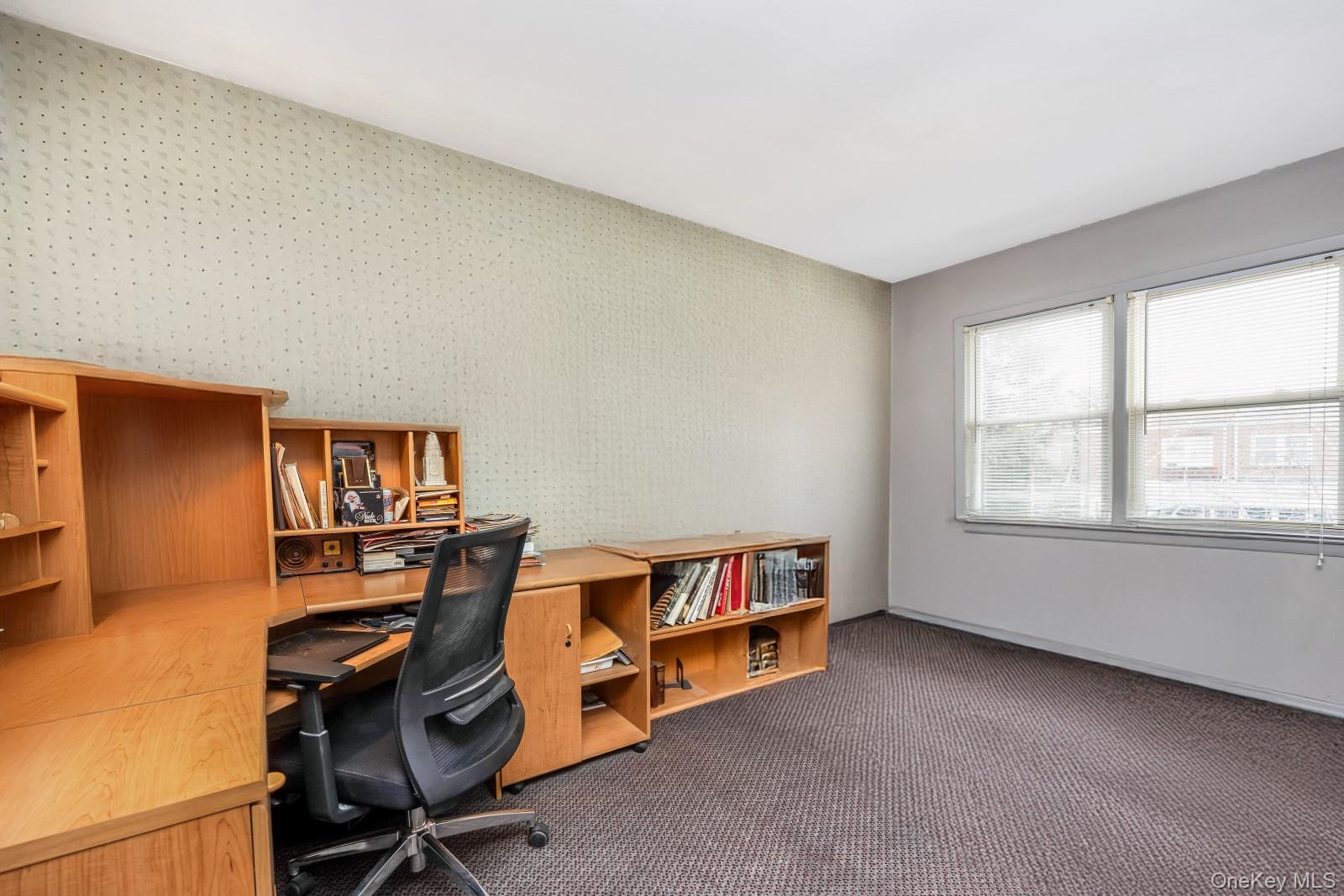 69-31 61st Road Queens, NY 11379 - Photo 15 of 28 a view of a workspace with furniture and a window