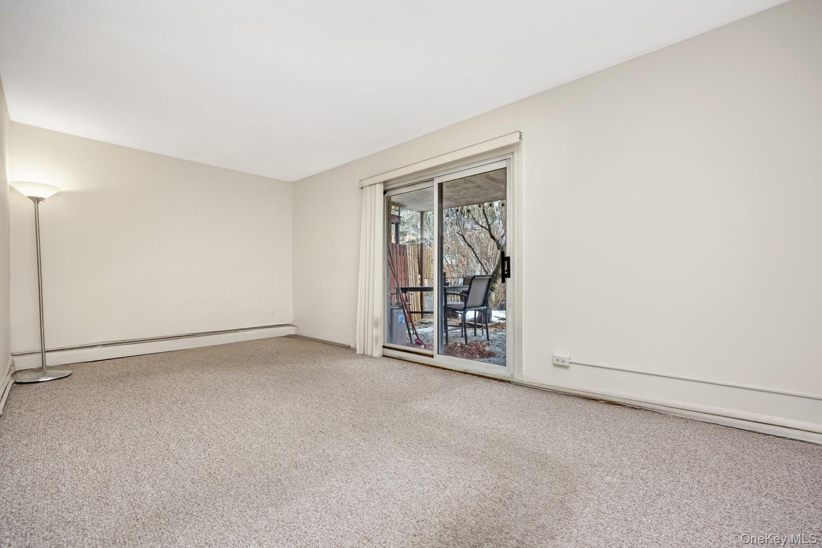 69-31 61st Road Queens, NY 11379 - Photo 17 of 28 an empty room with windows