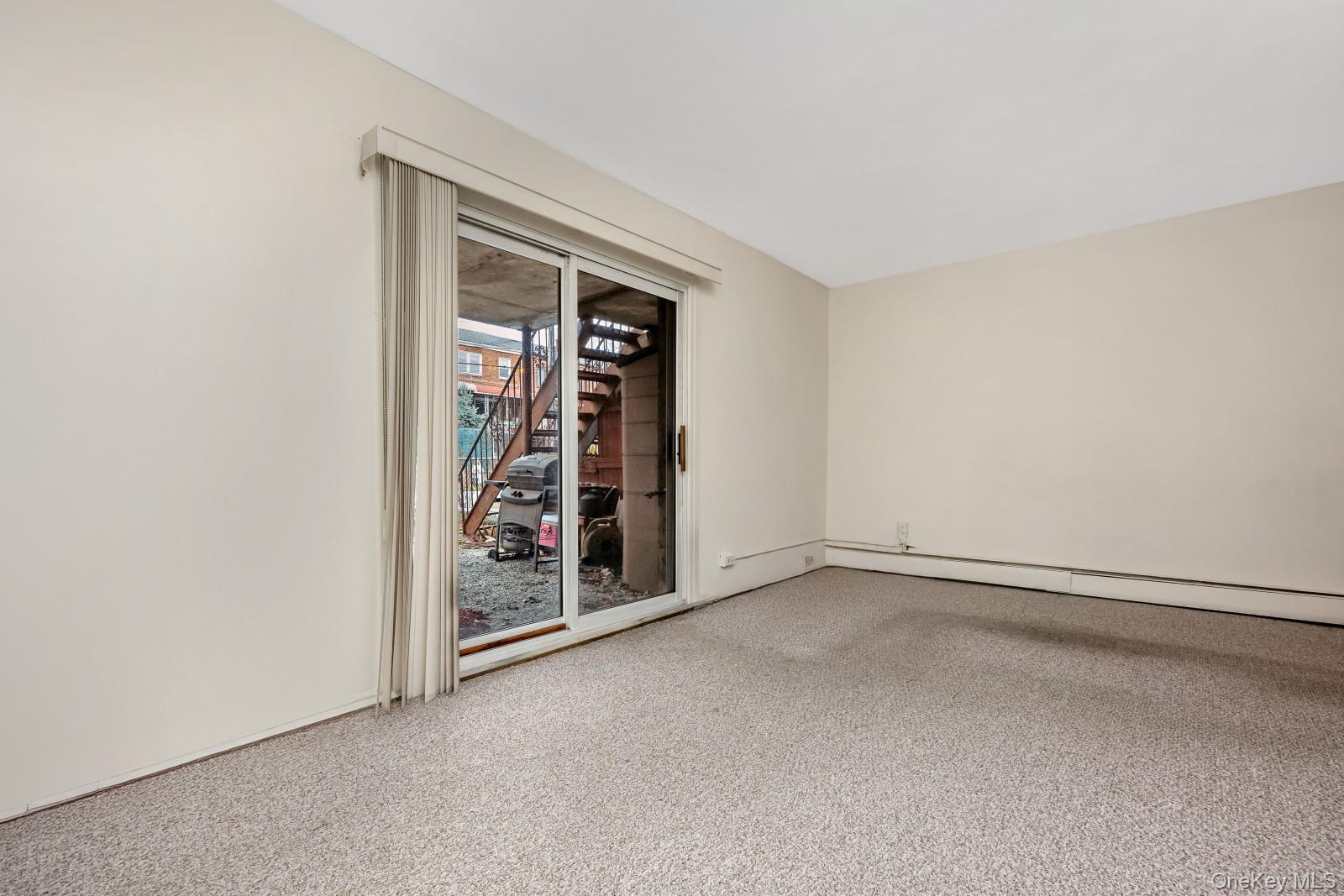 69-31 61st Road Queens, NY 11379 - Photo 18 of 28 an empty room with windows