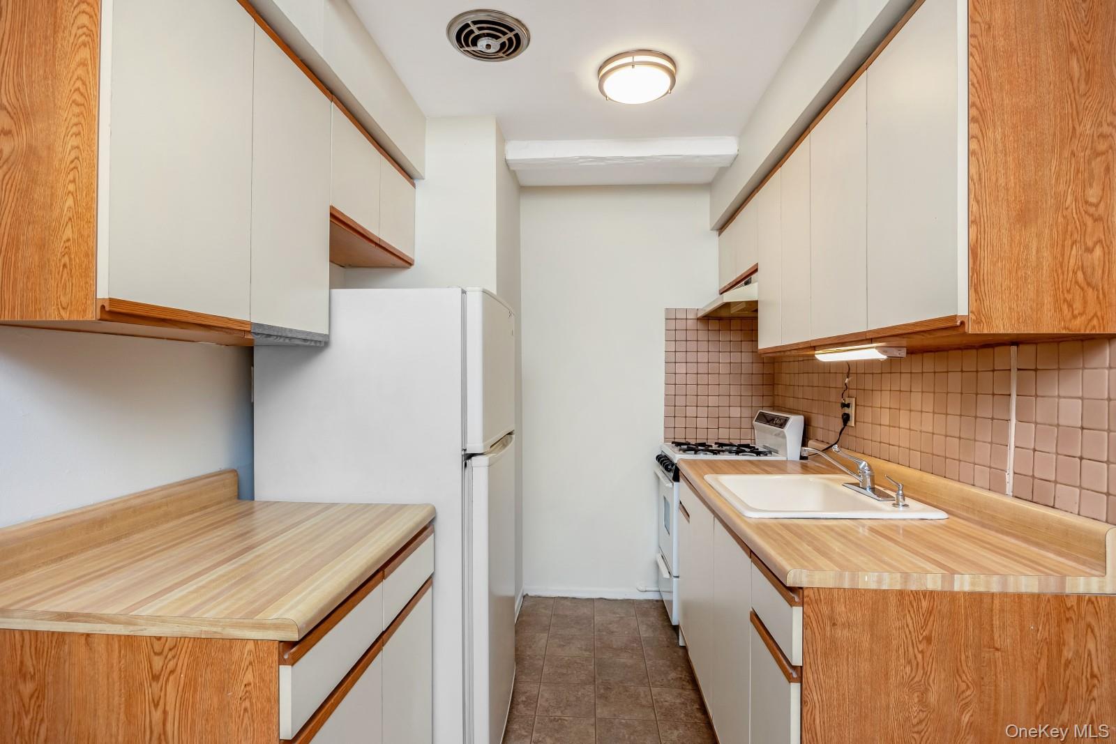 69-31 61st Road Queens, NY 11379 - Photo 21 of 28 a room with storage and utility