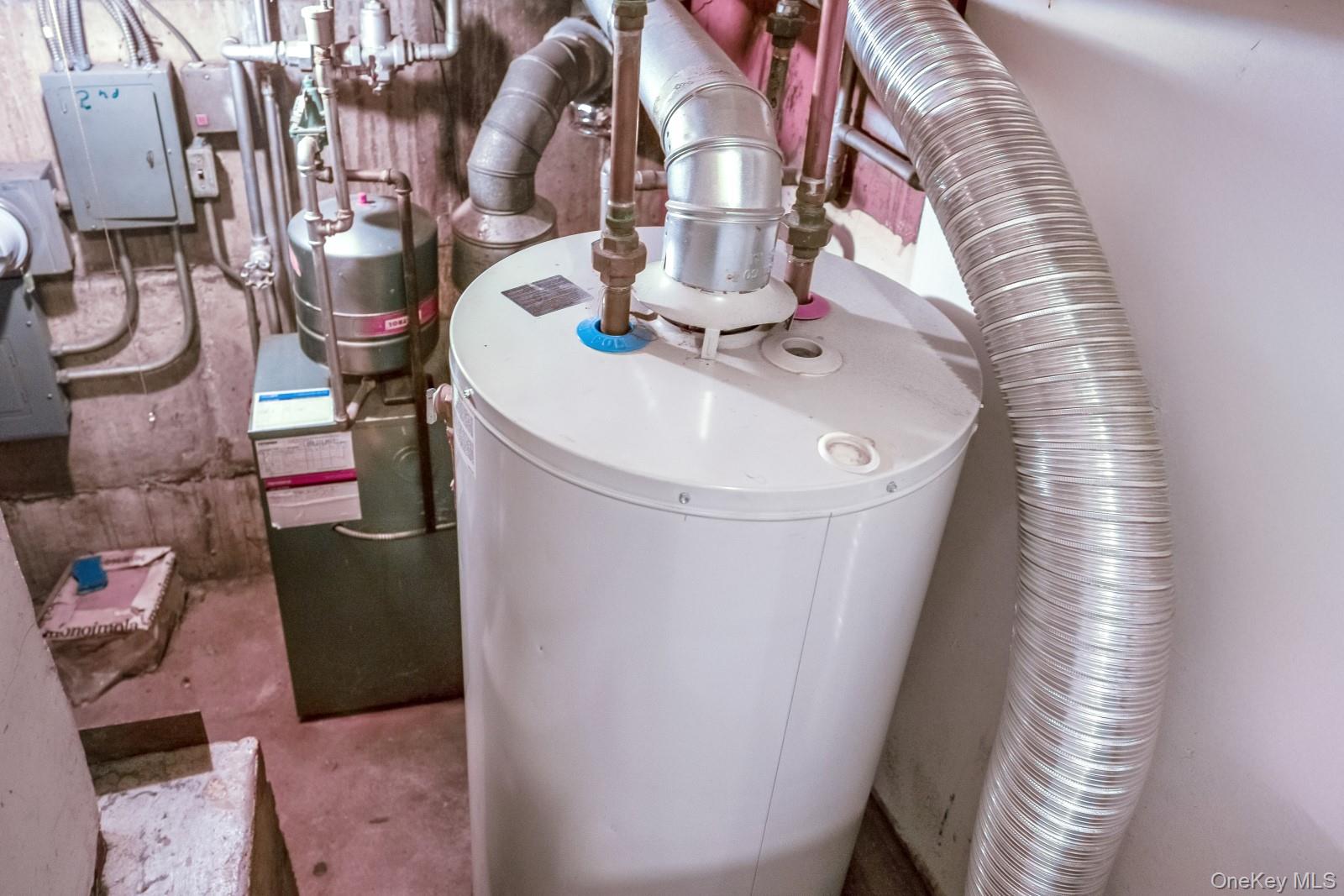 69-31 61st Road Queens, NY 11379 - Photo 25 of 28 a utility room with multiple dryer and washer