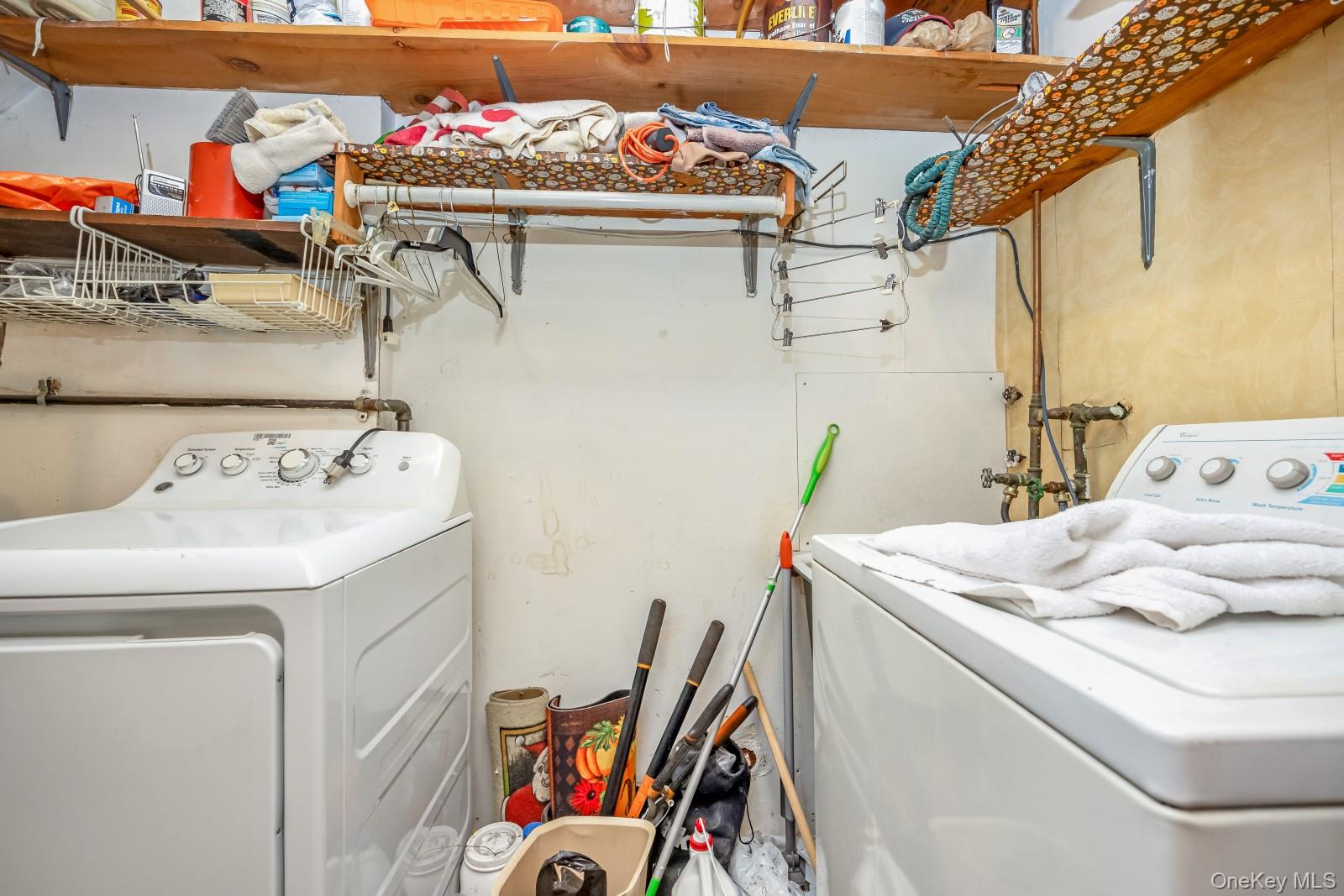 69-31 61st Road Queens, NY 11379 - Photo 26 of 28 a utility room with dryer and washer