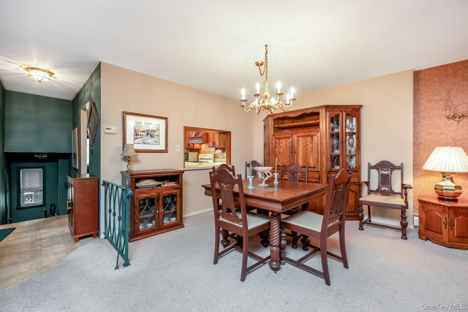 69-31 61st Road Queens, NY 11379 - Photo 5 of 28 a view of a livingroom with furniture and chandelier