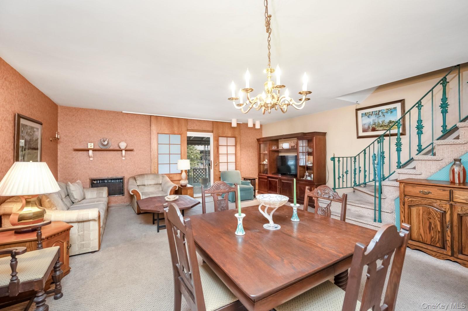 69-31 61st Road Queens, NY 11379 - Photo 6 of 28 a view of a dining room with furniture a chandelier and wooden floor