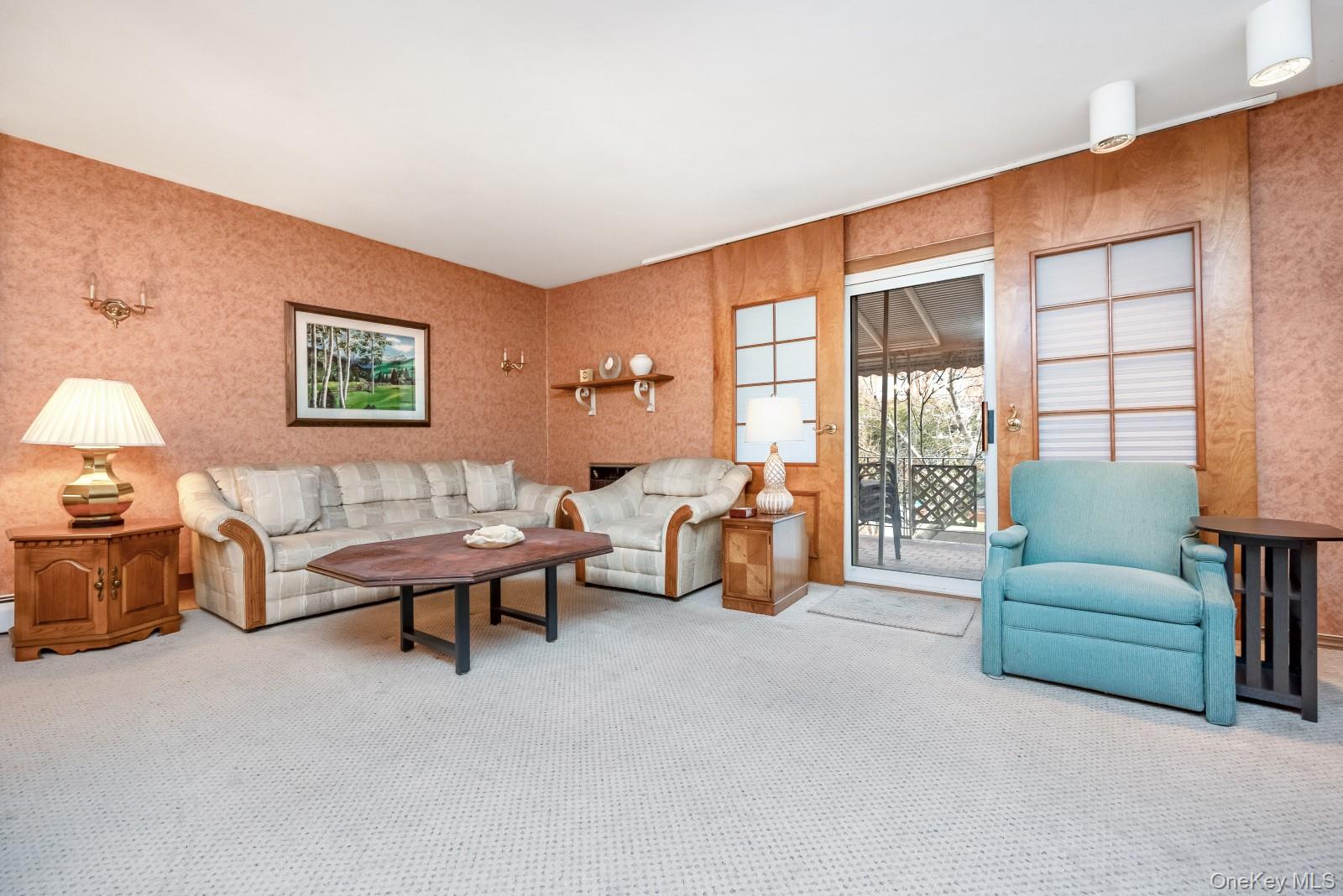 69-31 61st Road Queens, NY 11379 - Photo 7 of 28 a living room with furniture and a large window