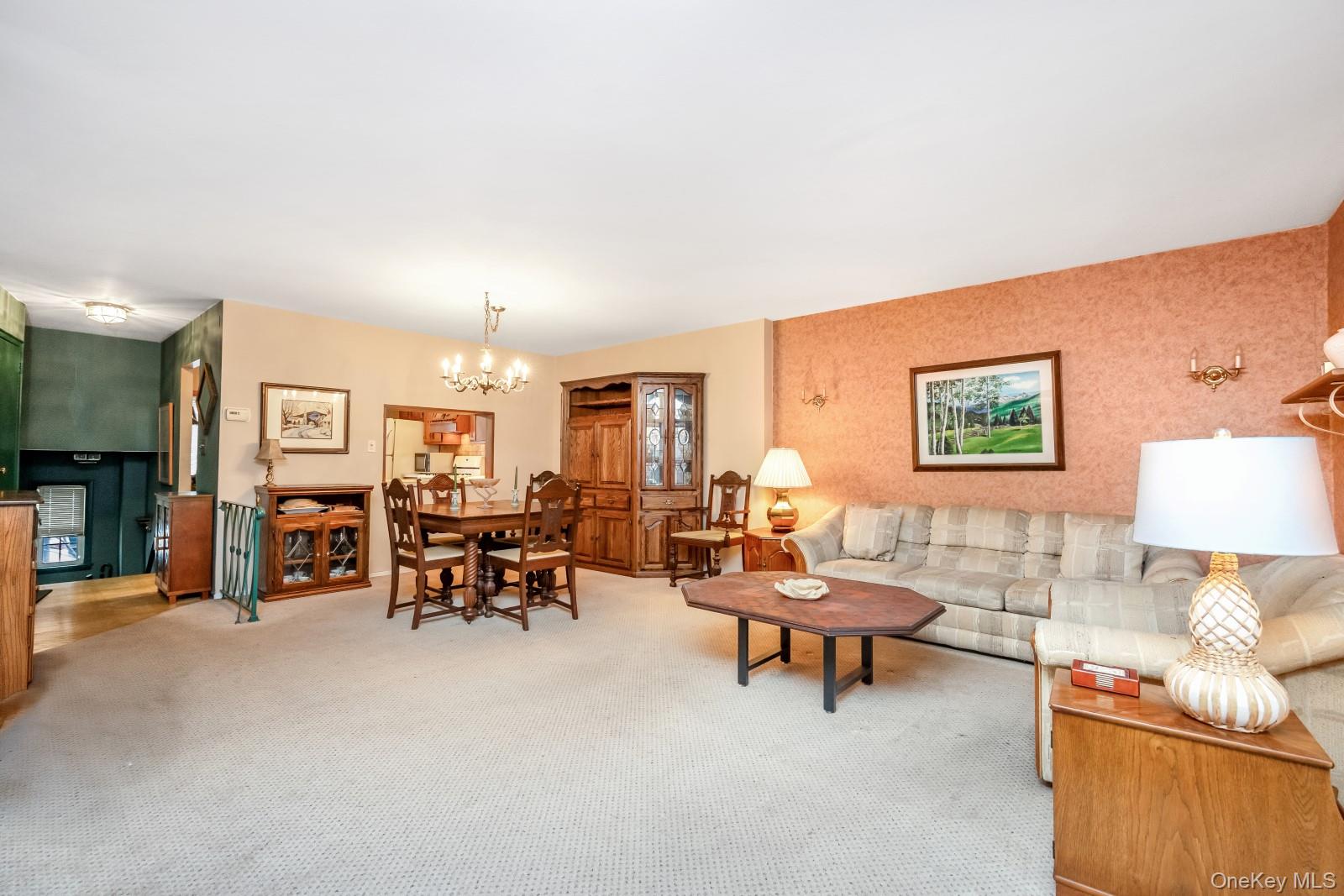 69-31 61st Road Queens, NY 11379 - Photo 9 of 28 a living room with furniture and a flat screen tv