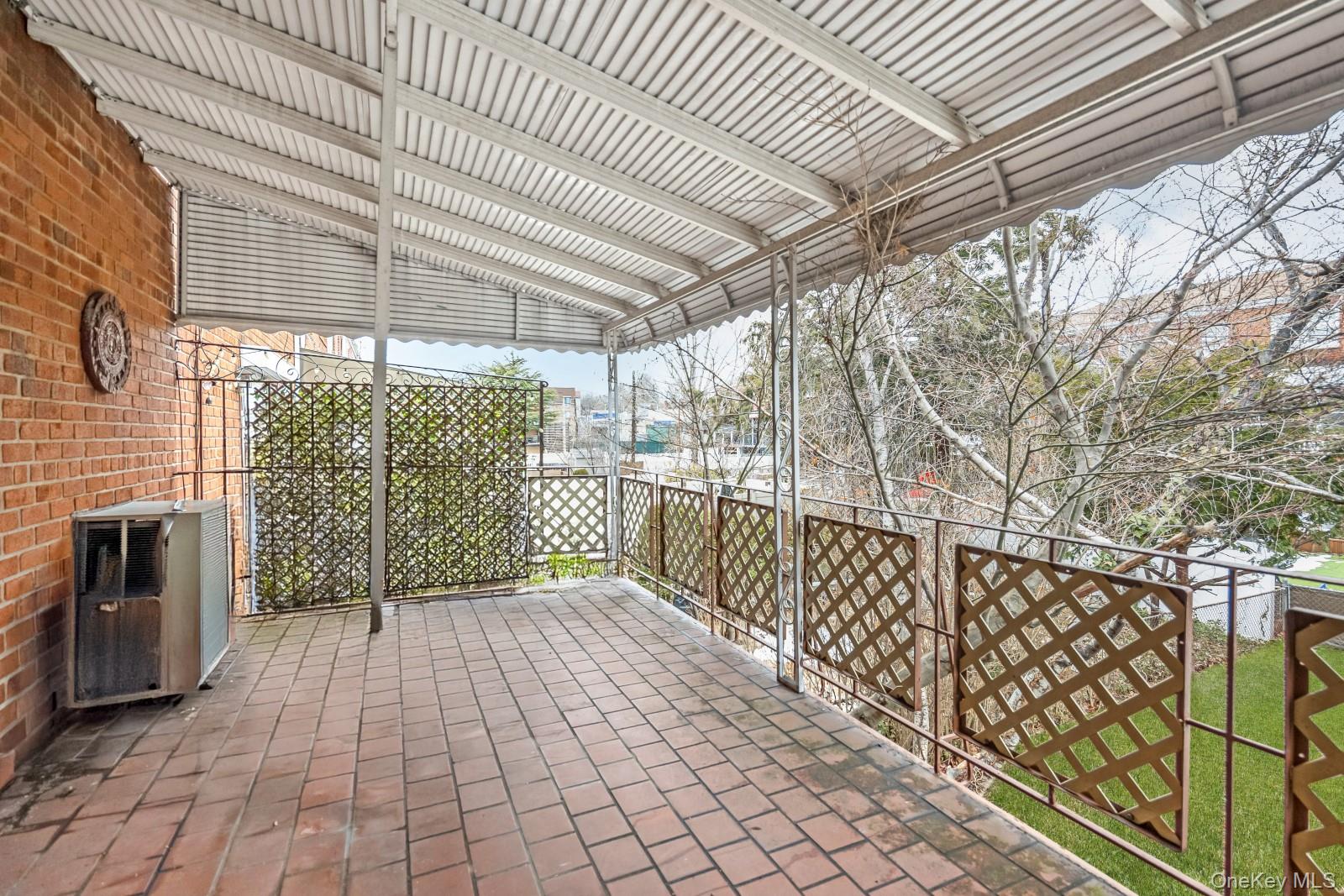 69-31 61st Road Queens, NY 11379 - Photo 10 of 28 a view of a pathway with a balcony