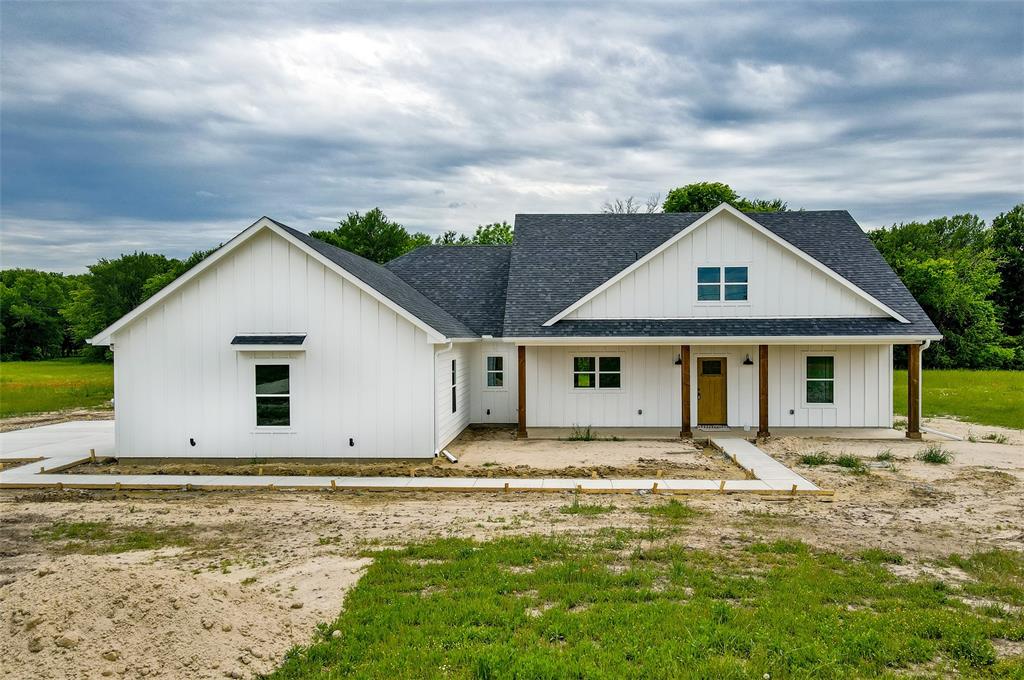2805 County Road 3820 Wills Point, TX 75169 - Photo 1 of 1 a front view of house with yard and trees around