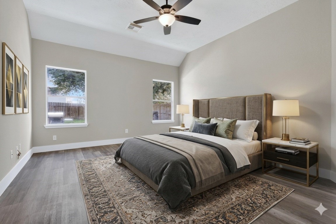 20926 Trellis Lane Houston, TX 77073 - Photo 6 of 22 Primary bedroom features laminate flooring and ample space with great views (virtually staged).