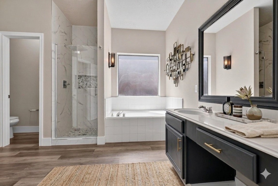 20926 Trellis Lane Houston, TX 77073 - Photo 9 of 22 Primary bathroom also includes walk in shower and private toilet room (virtually staged).