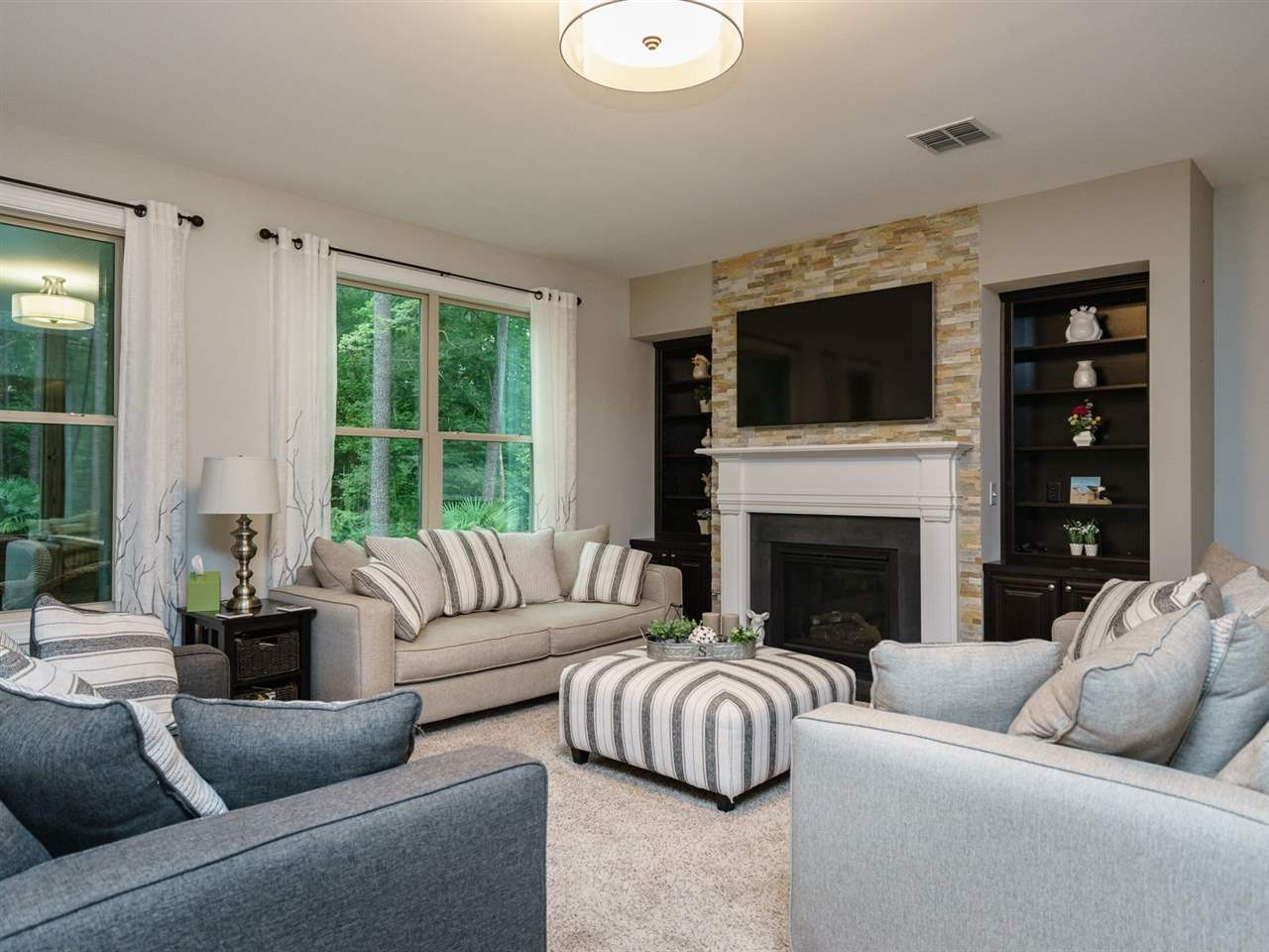 4844 Inwood Road Raleigh, NC 27603 - Photo 8 of 25 The family room has a gas log fireplace that is flanked by built-ins. Family Room