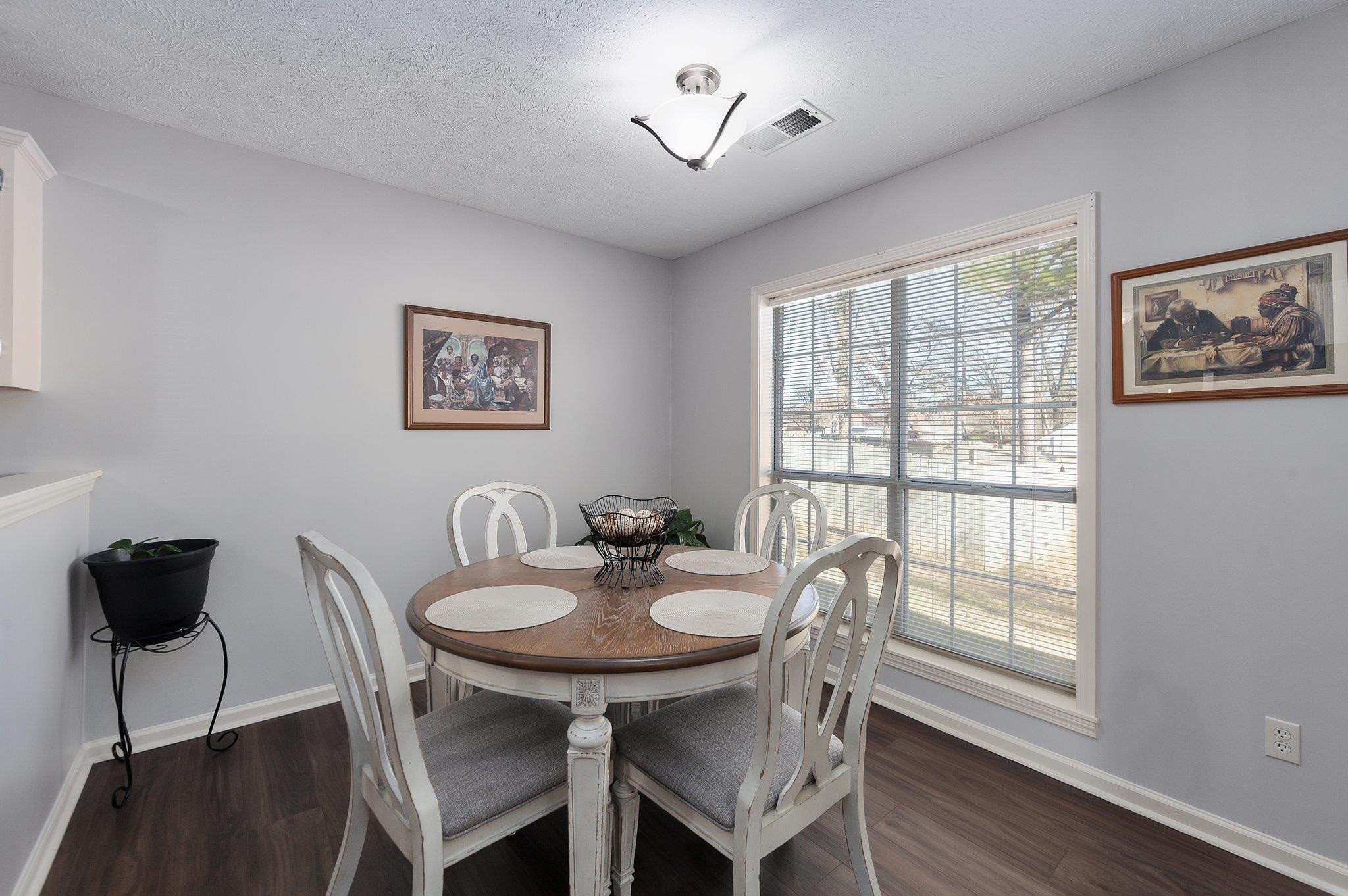 121 Windy Hill Road Jackson, TN 38305 - Photo 11 of 25 a view of a dining room with furniture window and wooden floor