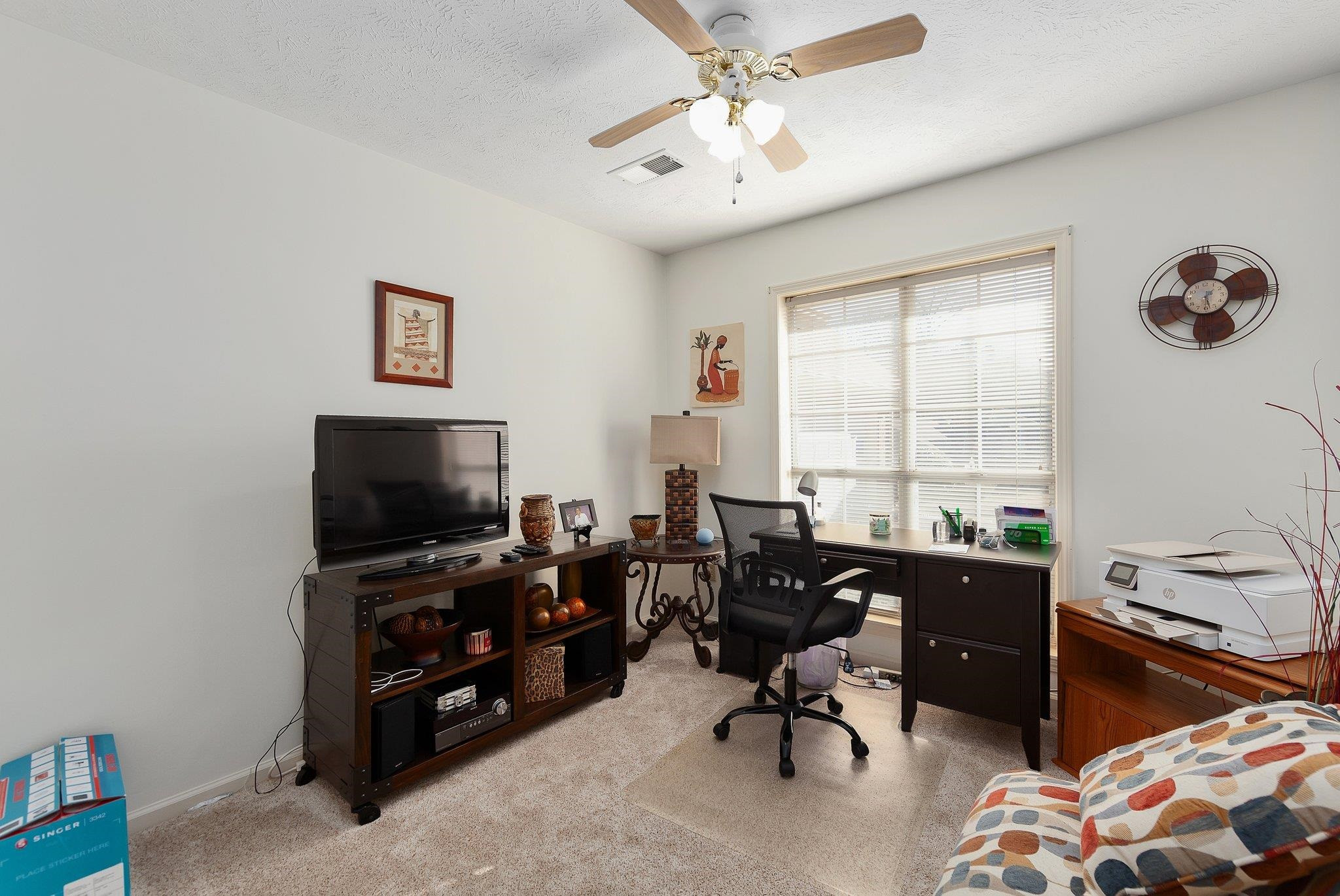 121 Windy Hill Road Jackson, TN 38305 - Photo 16 of 25 a view of a livingroom with workspace and a window