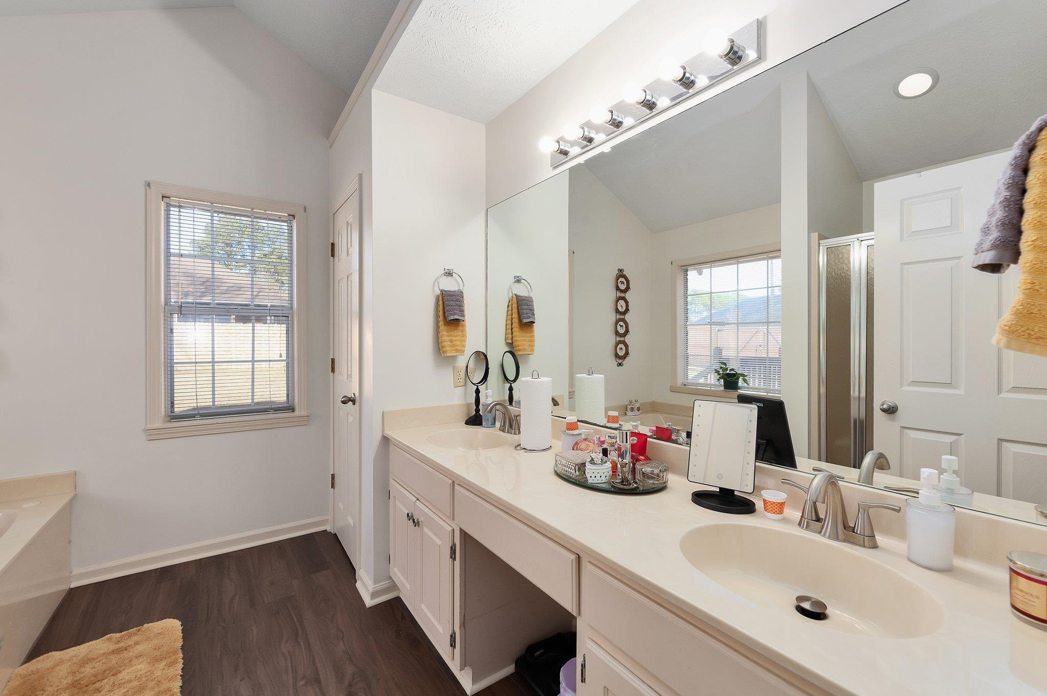 121 Windy Hill Road Jackson, TN 38305 - Photo 17 of 25 a bathroom with double vanity and a mirror