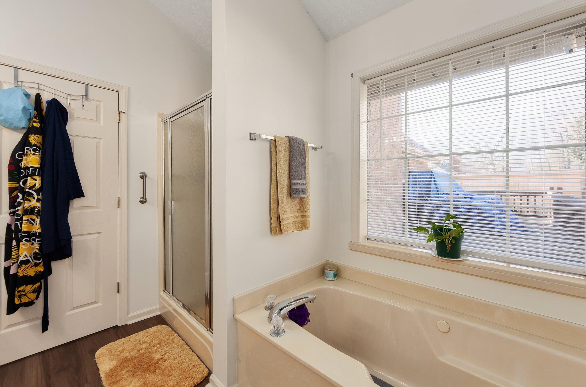 121 Windy Hill Road Jackson, TN 38305 - Photo 18 of 25 a bathroom with a tub and a shower