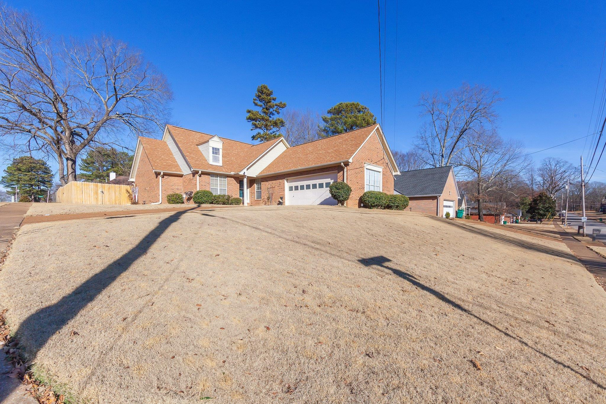 121 Windy Hill Road Jackson, TN 38305 - Photo 24 of 25 a view of an house with backyard and trees