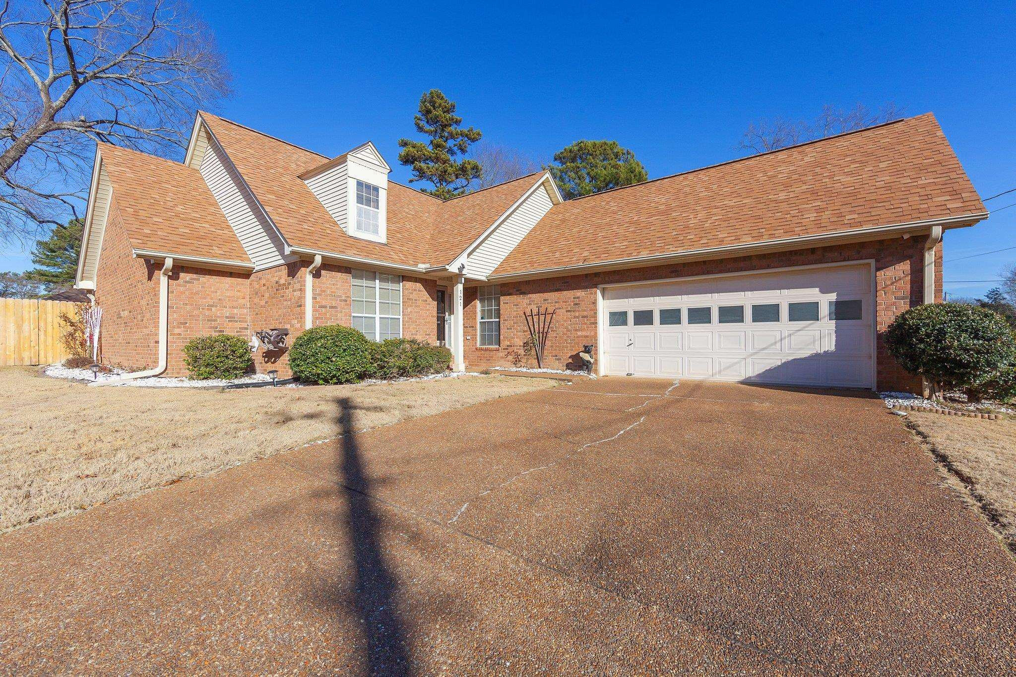 121 Windy Hill Road Jackson, TN 38305 - Photo 25 of 25 a front view of a house with a yard and garage