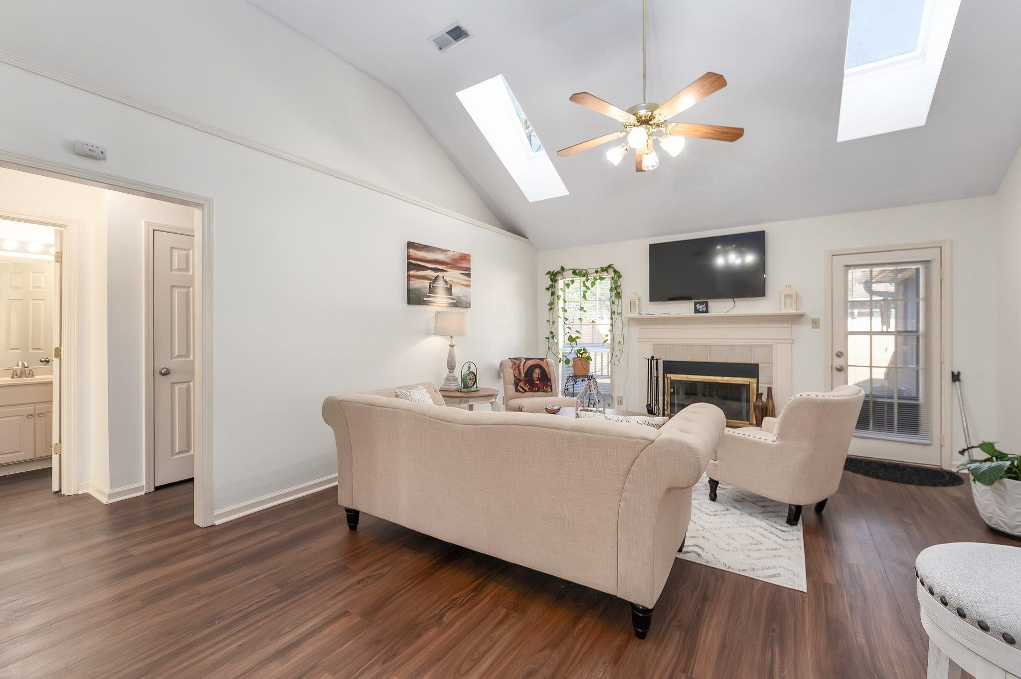 121 Windy Hill Road Jackson, TN 38305 - Photo 3 of 25 a living room with furniture a fireplace and a flat screen tv