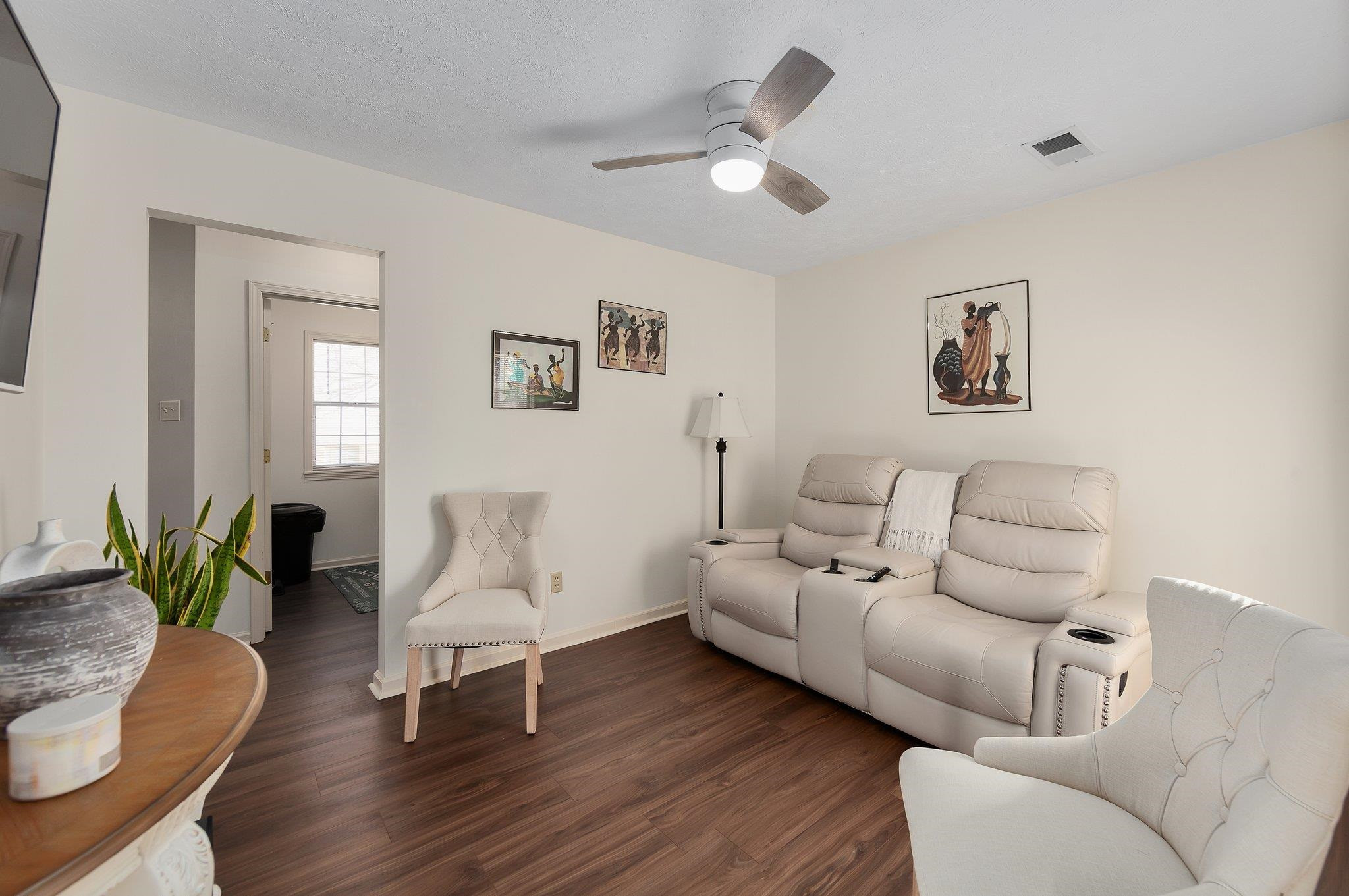 121 Windy Hill Road Jackson, TN 38305 - Photo 5 of 25 a living room with furniture and wooden floor