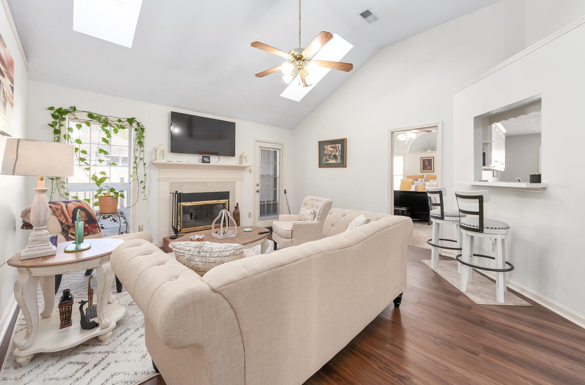 121 Windy Hill Road Jackson, TN 38305 - Photo 6 of 25 a living room with furniture a fireplace and a flat screen tv