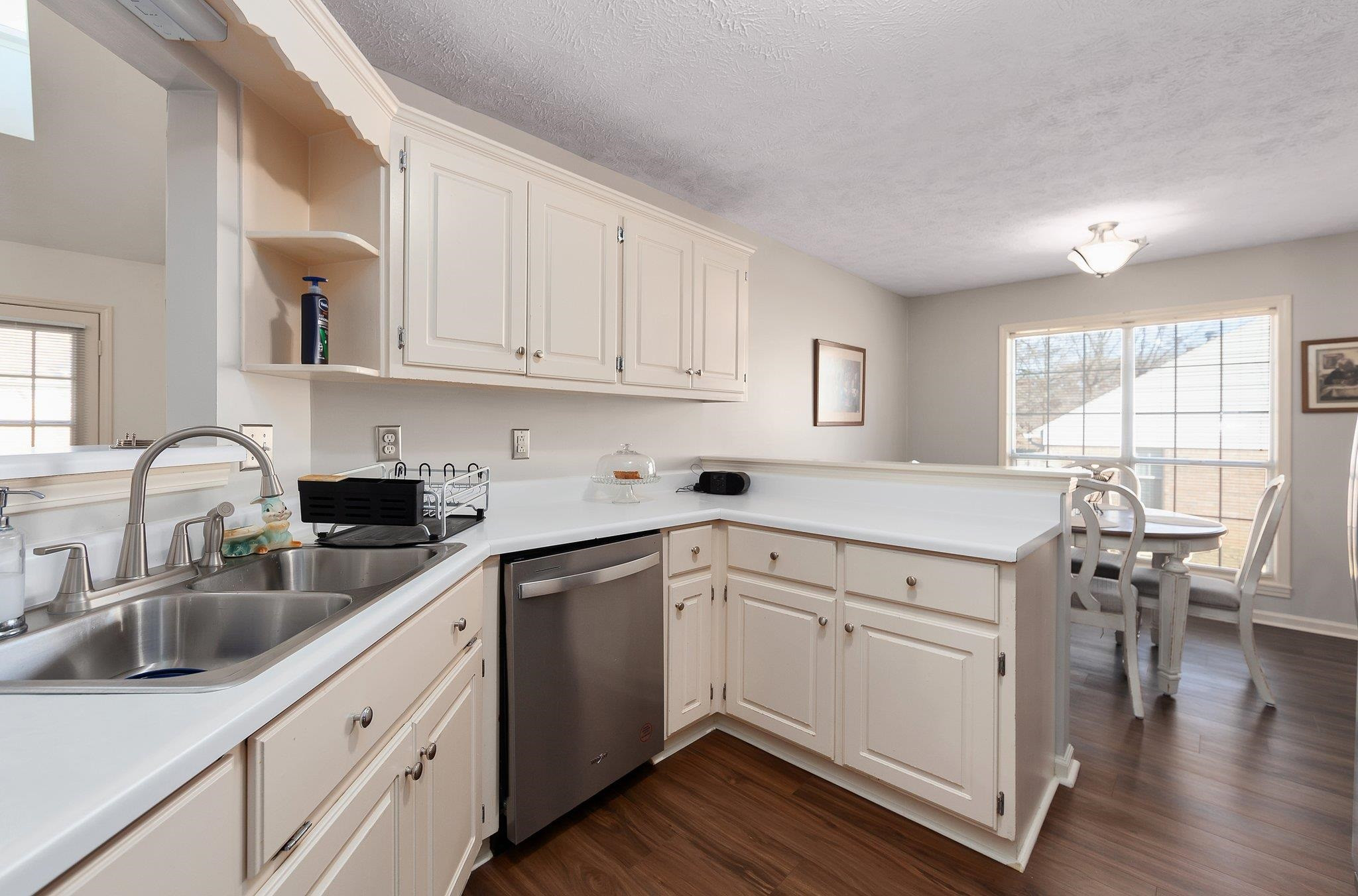 121 Windy Hill Road Jackson, TN 38305 - Photo 7 of 25 a kitchen with a sink cabinets and wooden floor