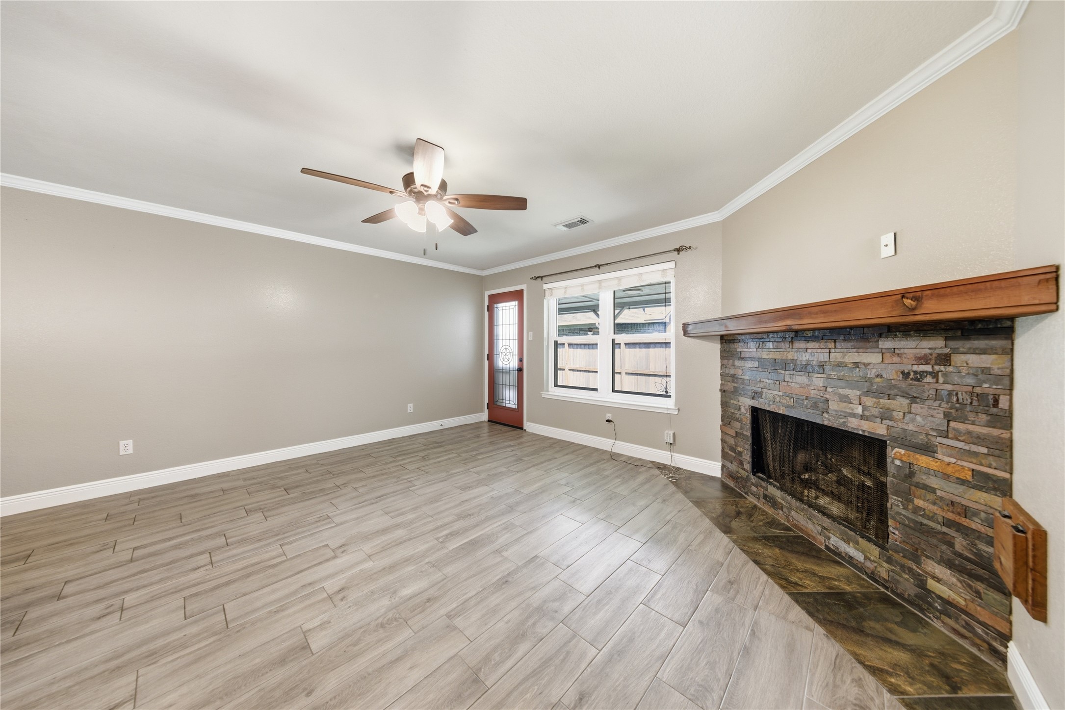 13506 Spring Court Tomball, TX 77375 - Photo 5 of 37 a view of a livingroom with a fireplace and window