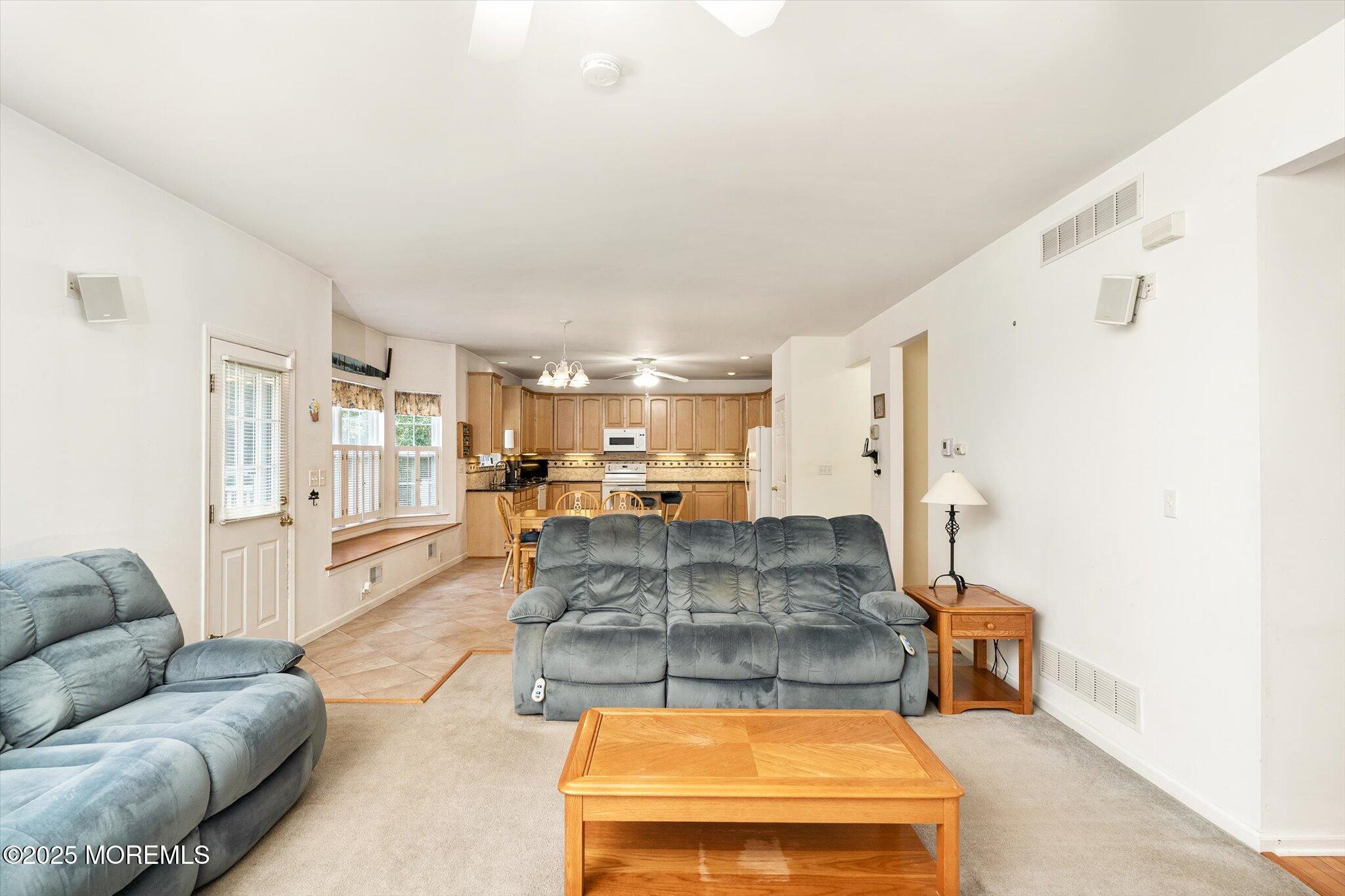 90 Sanders Lane Cream Ridge, NJ 08514 - Photo 12 of 48 a living room with furniture and a large window