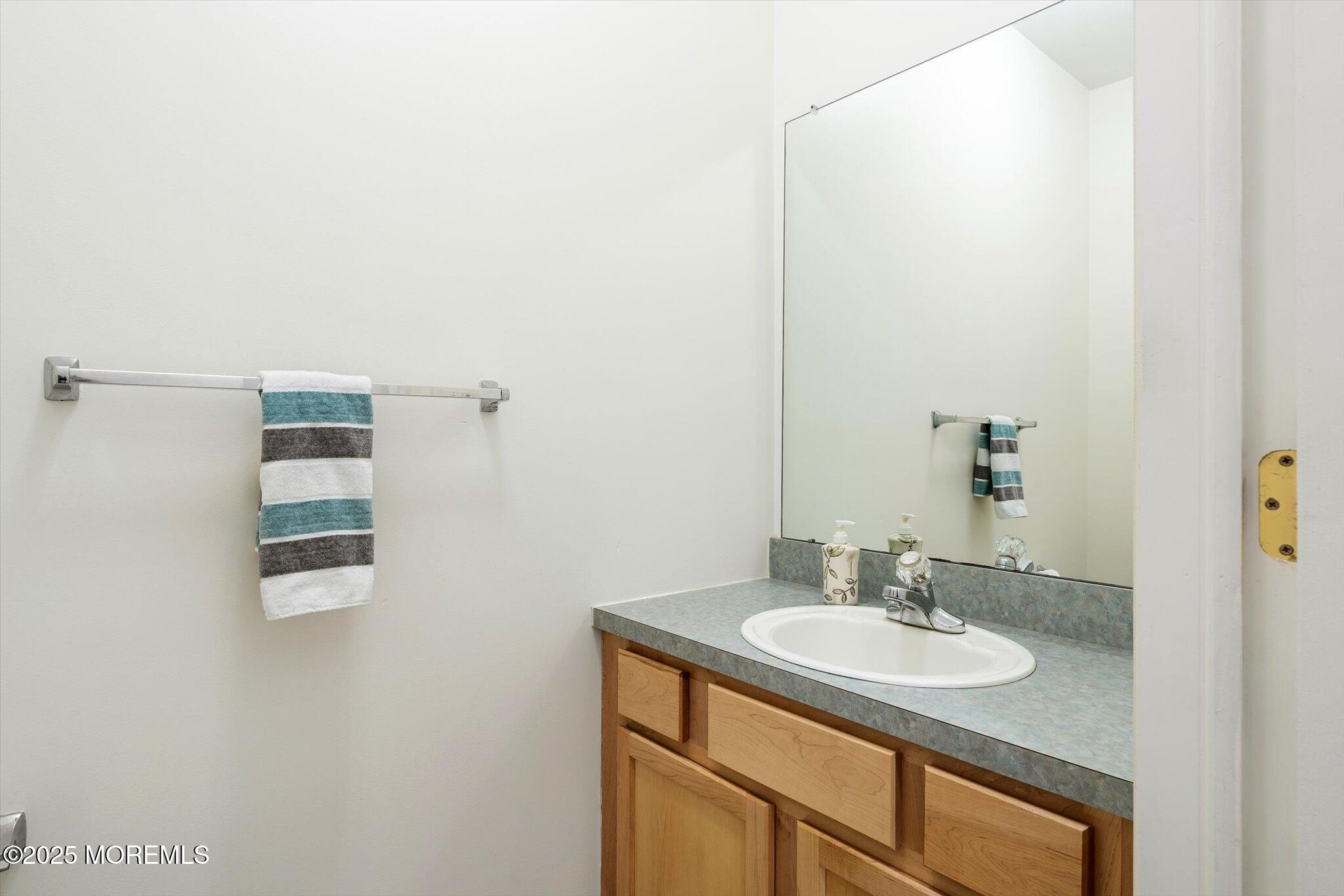 90 Sanders Lane Cream Ridge, NJ 08514 - Photo 17 of 48 a bathroom with a sink and a mirror