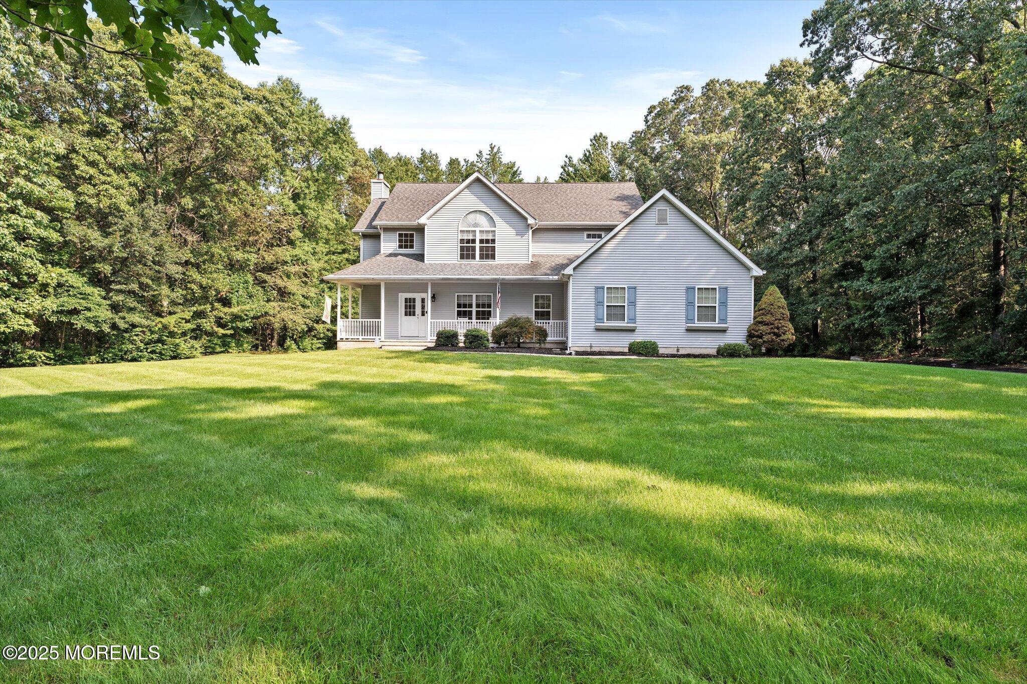 90 Sanders Lane Cream Ridge, NJ 08514 - Photo 2 of 48 a view of a house with a big yard and large trees