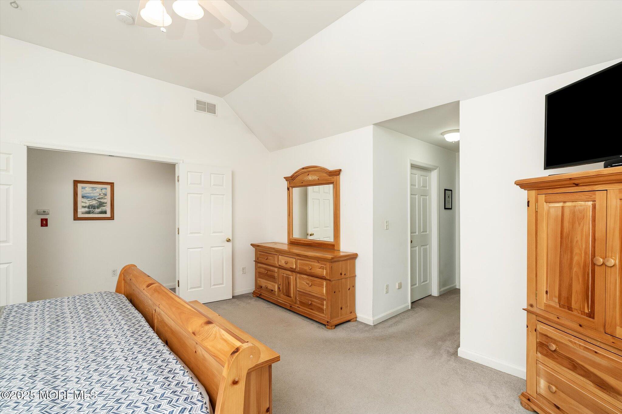 90 Sanders Lane Cream Ridge, NJ 08514 - Photo 21 of 48 a bedroom with bed and flat screen tv