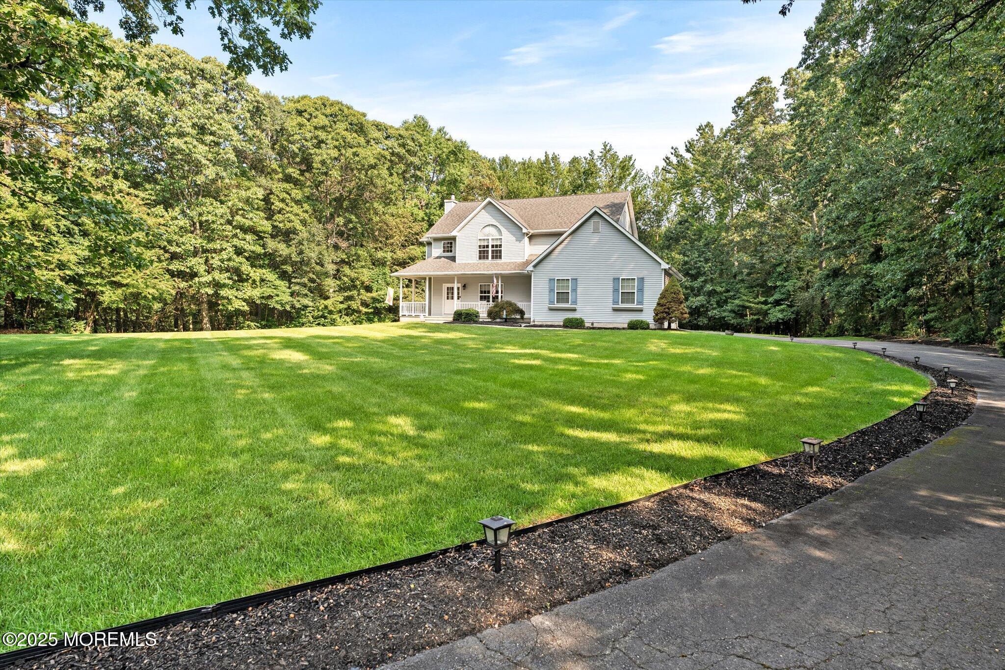 90 Sanders Lane Cream Ridge, NJ 08514 - Photo 3 of 48 a view of a house with a yard and large trees