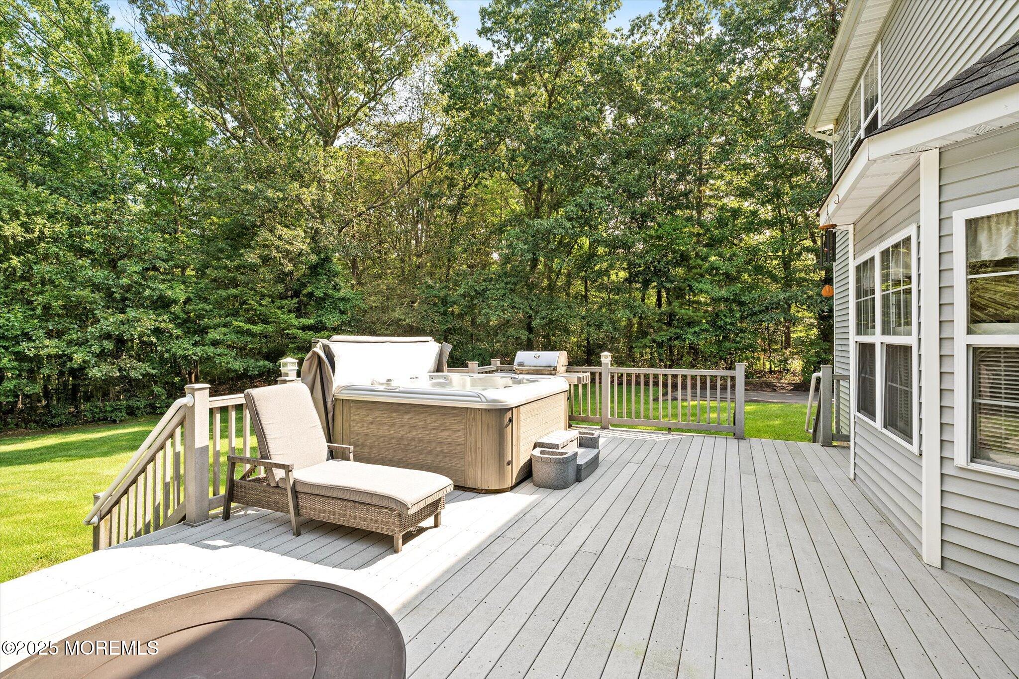 90 Sanders Lane Cream Ridge, NJ 08514 - Photo 32 of 48 a view of a deck with couches chairs and wooden floor