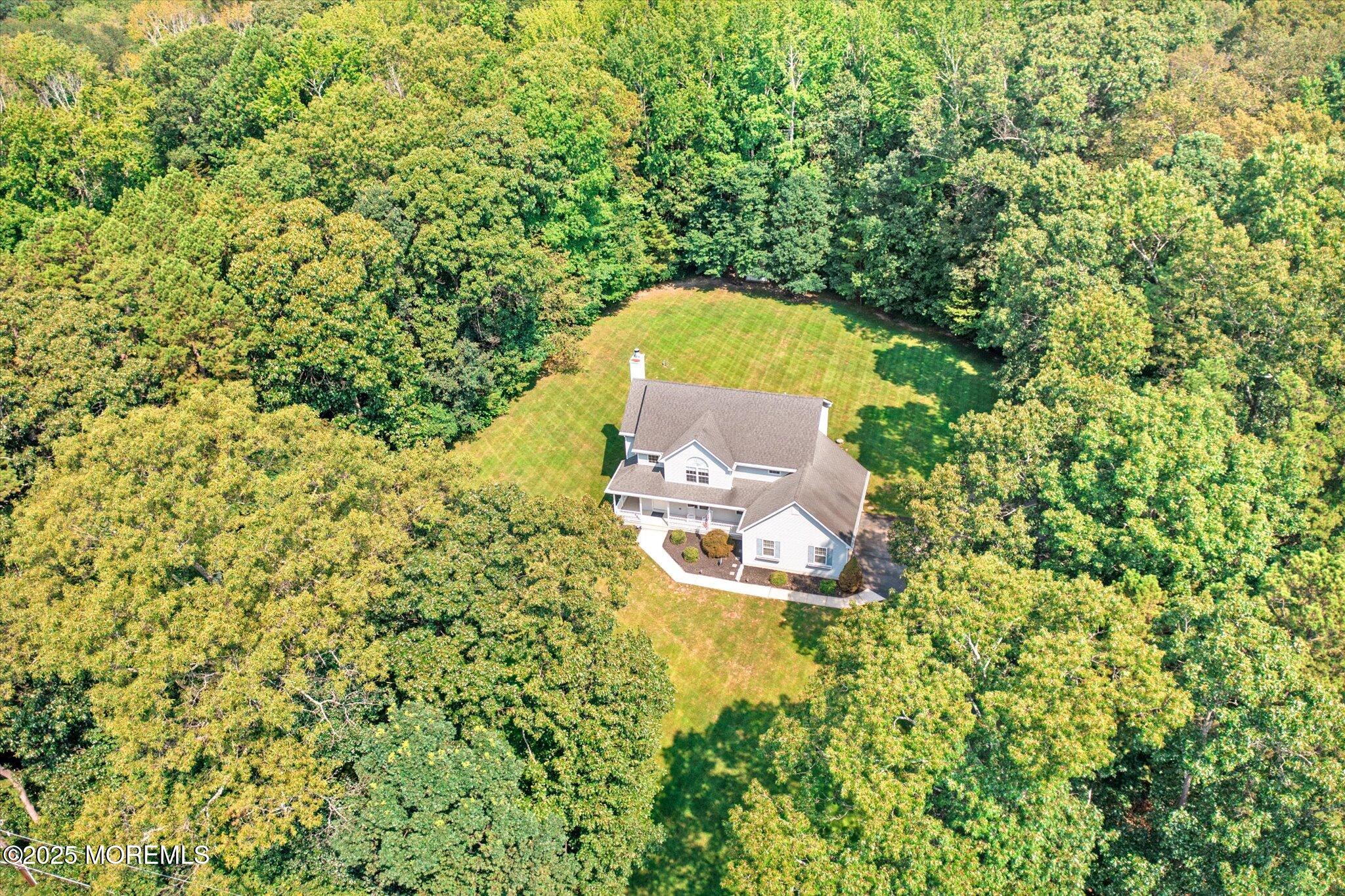 90 Sanders Lane Cream Ridge, NJ 08514 - Photo 37 of 48 an aerial view of a house with a swimming pool and green space