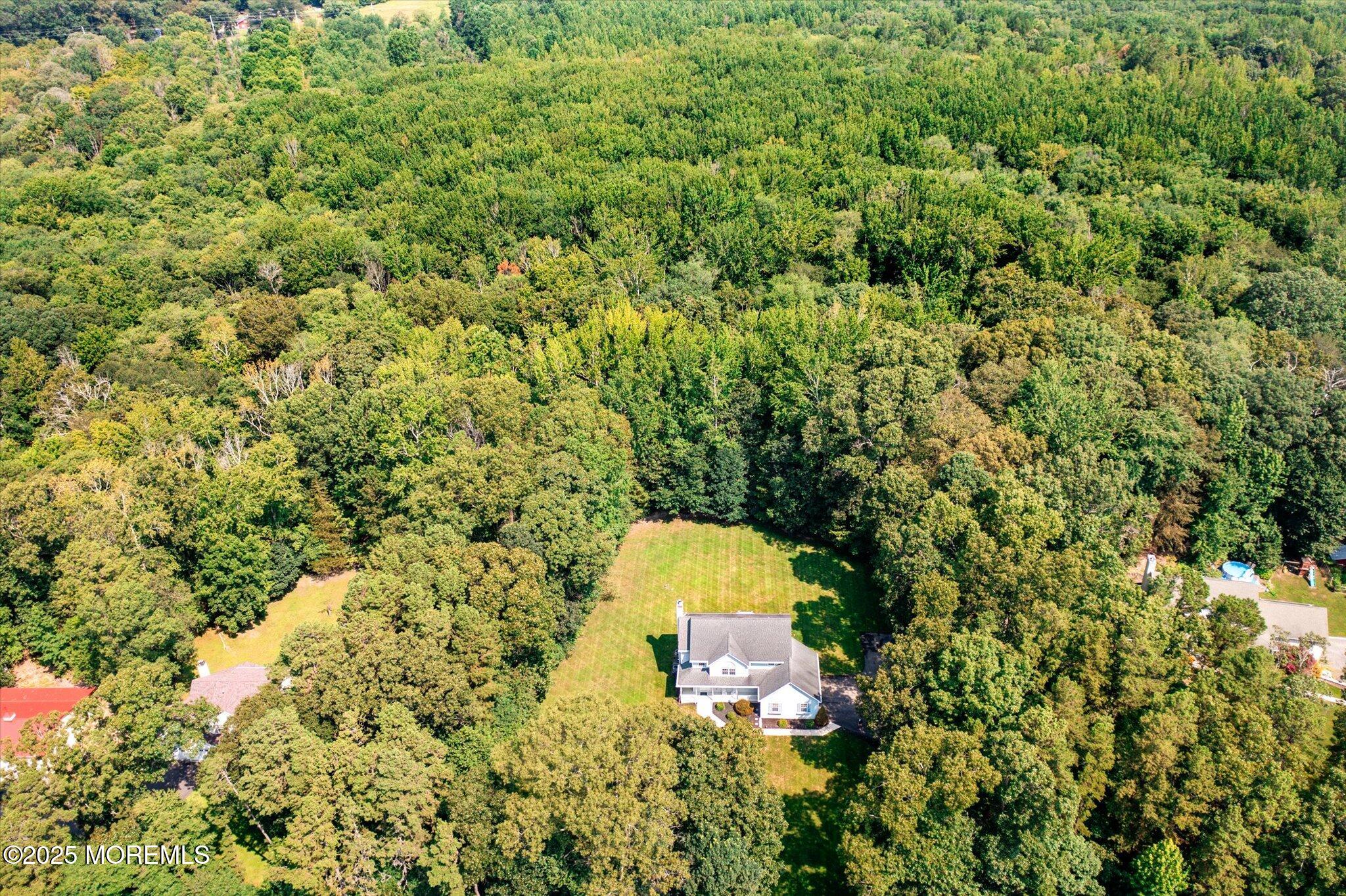 90 Sanders Lane Cream Ridge, NJ 08514 - Photo 38 of 48 a bird view of a house with a yard and large trees