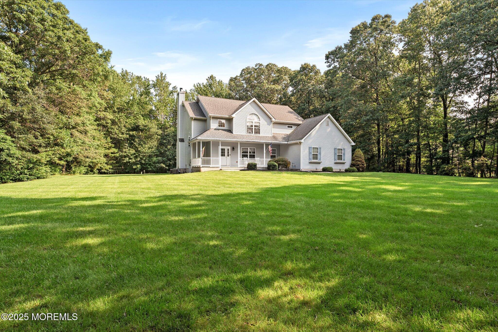 90 Sanders Lane Cream Ridge, NJ 08514 - Photo 4 of 48 a view of a house with a big yard and large trees