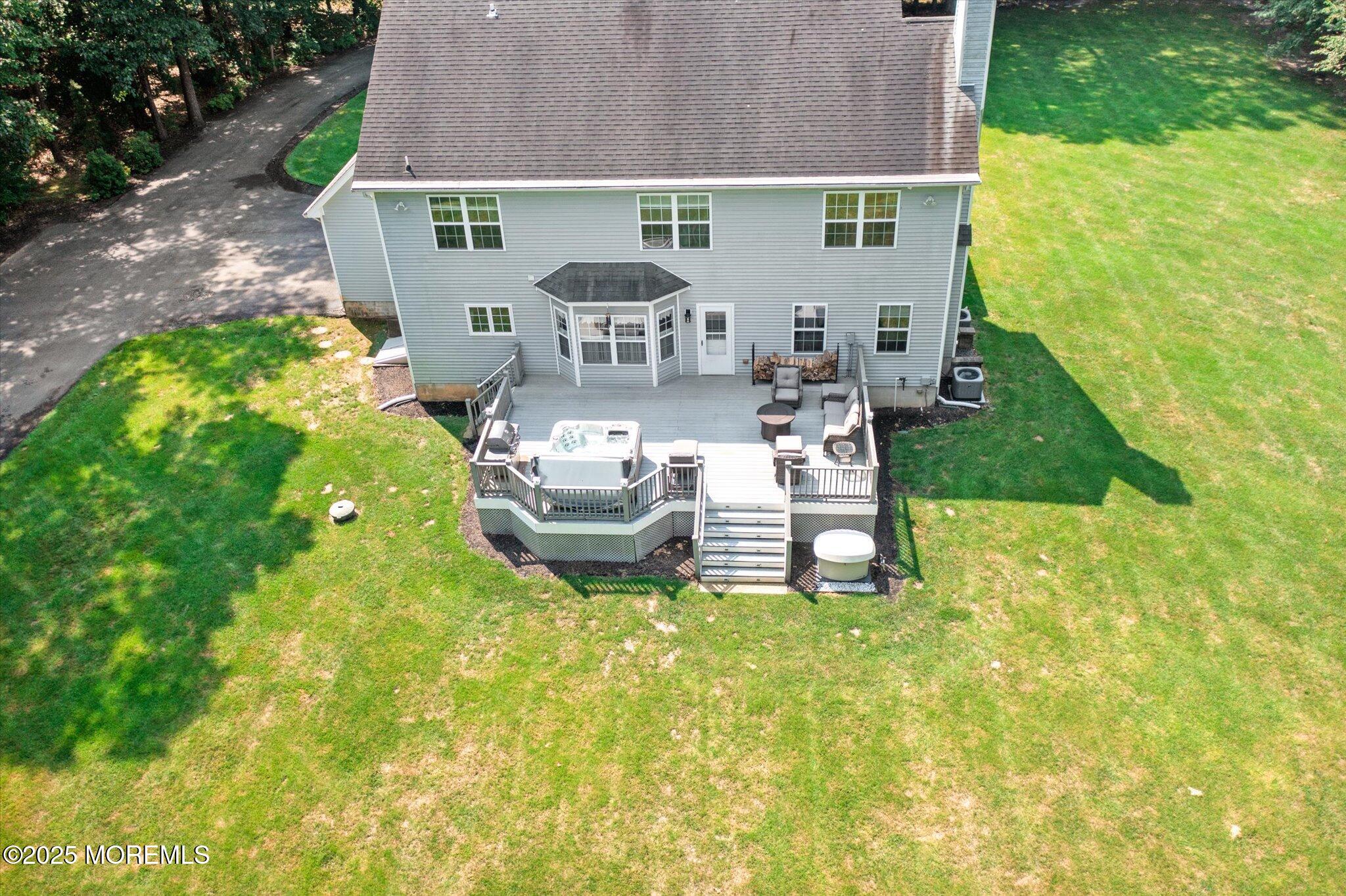 90 Sanders Lane Cream Ridge, NJ 08514 - Photo 42 of 48 a view of backyard with table and chairs and plants