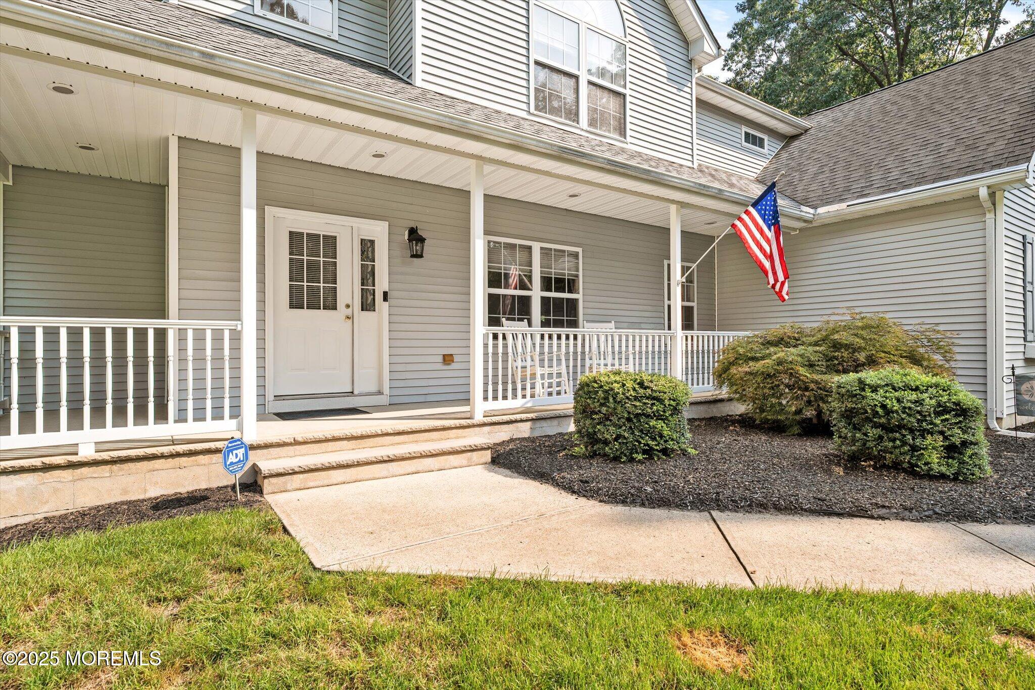 90 Sanders Lane Cream Ridge, NJ 08514 - Photo 6 of 48 a front view of a house with a yard
