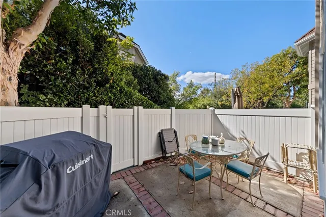a view of backyard with furniture and trees